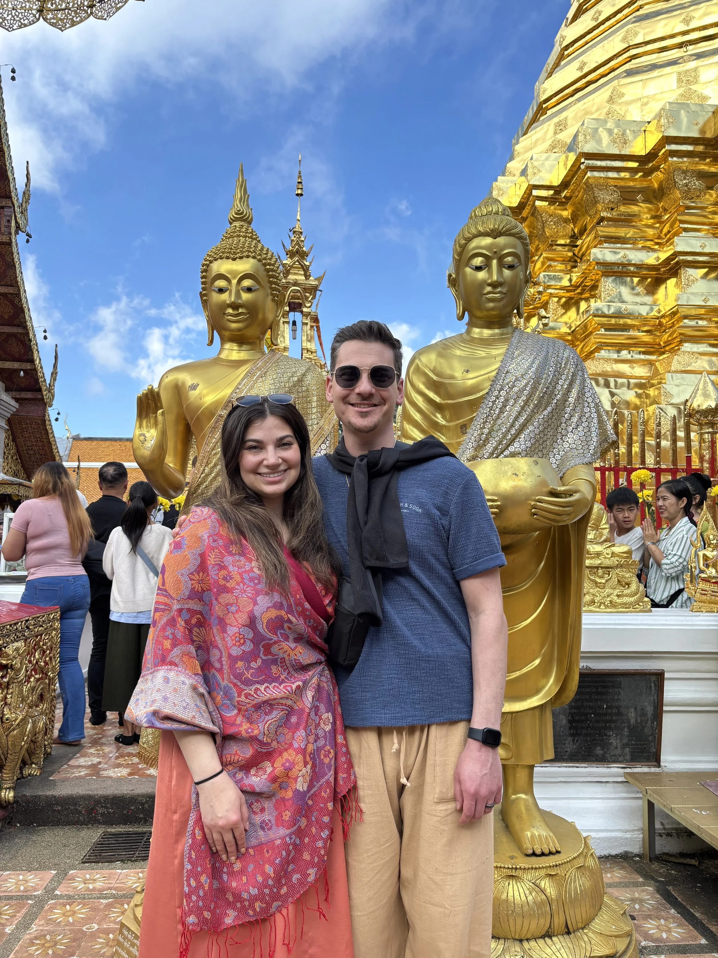 Aviva and Drew standing in front of the Doi Suthep temple in Chiang Mai, Thailand.