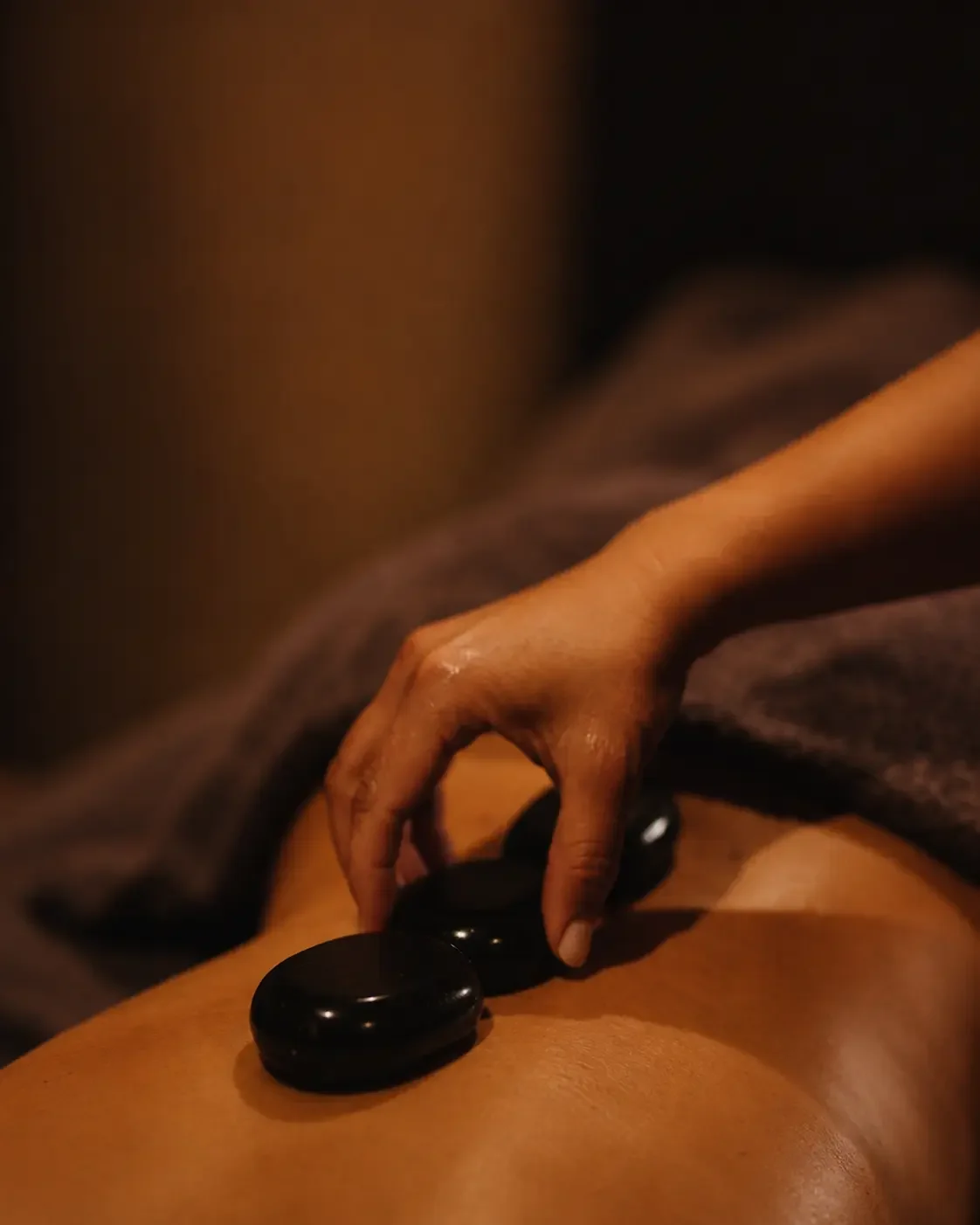 hot stone massage being done in blackall