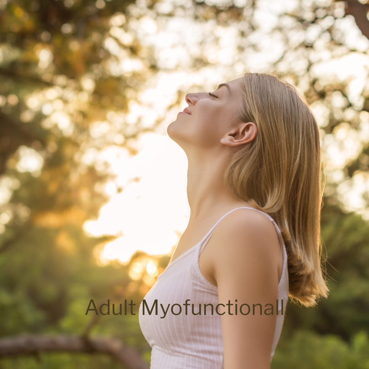 A woman with shoulder-length blonde hair is outdoors, standing in profile with her eyes closed and face tilted upward, enjoying the sunlight among trees.