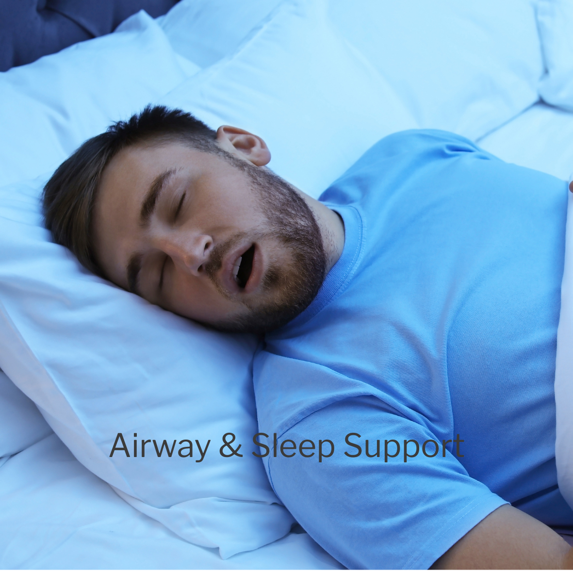 A man sleeping on a bed with a pillow, wearing a blue shirt, with the text 'Airway & Sleep Support' overlaid.
