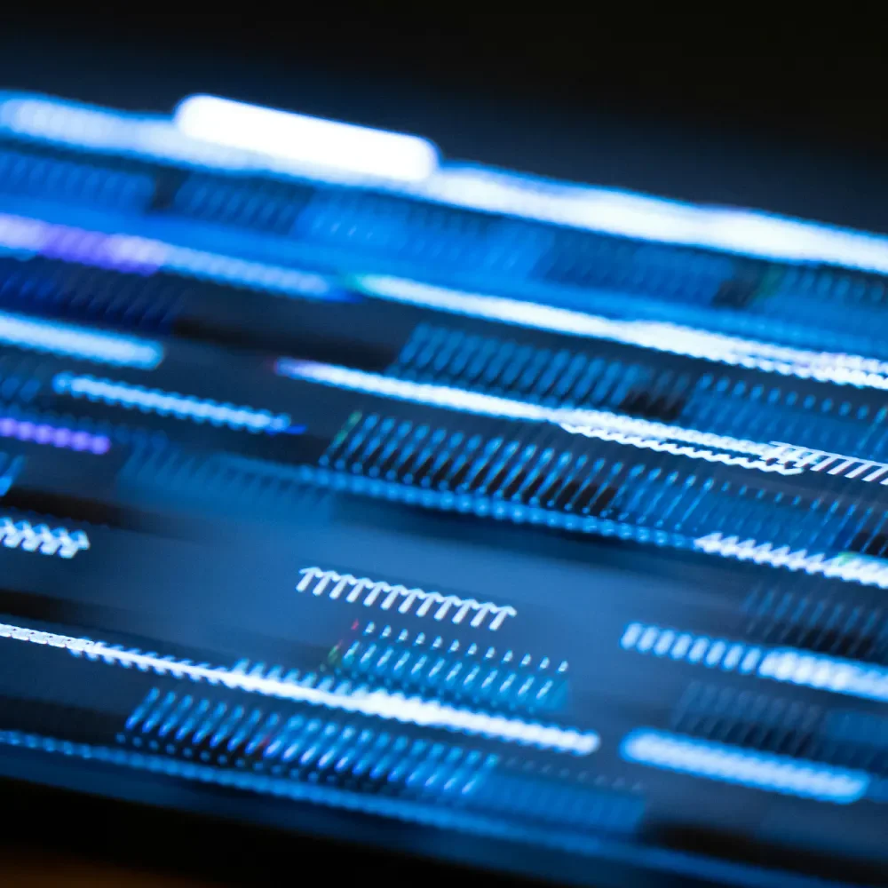 Close-up of a digital screen displaying intense blue and white lines and patterns.