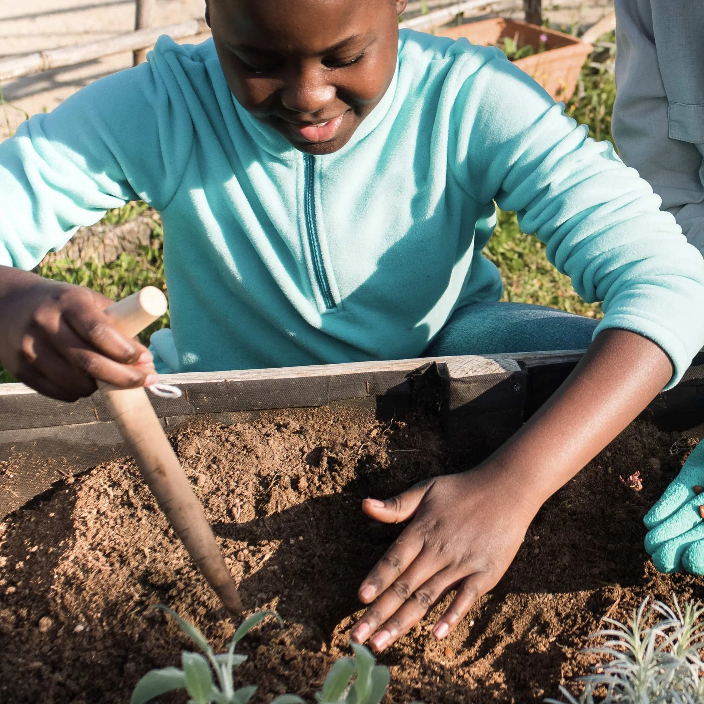 Student playing in the dirt.jpg