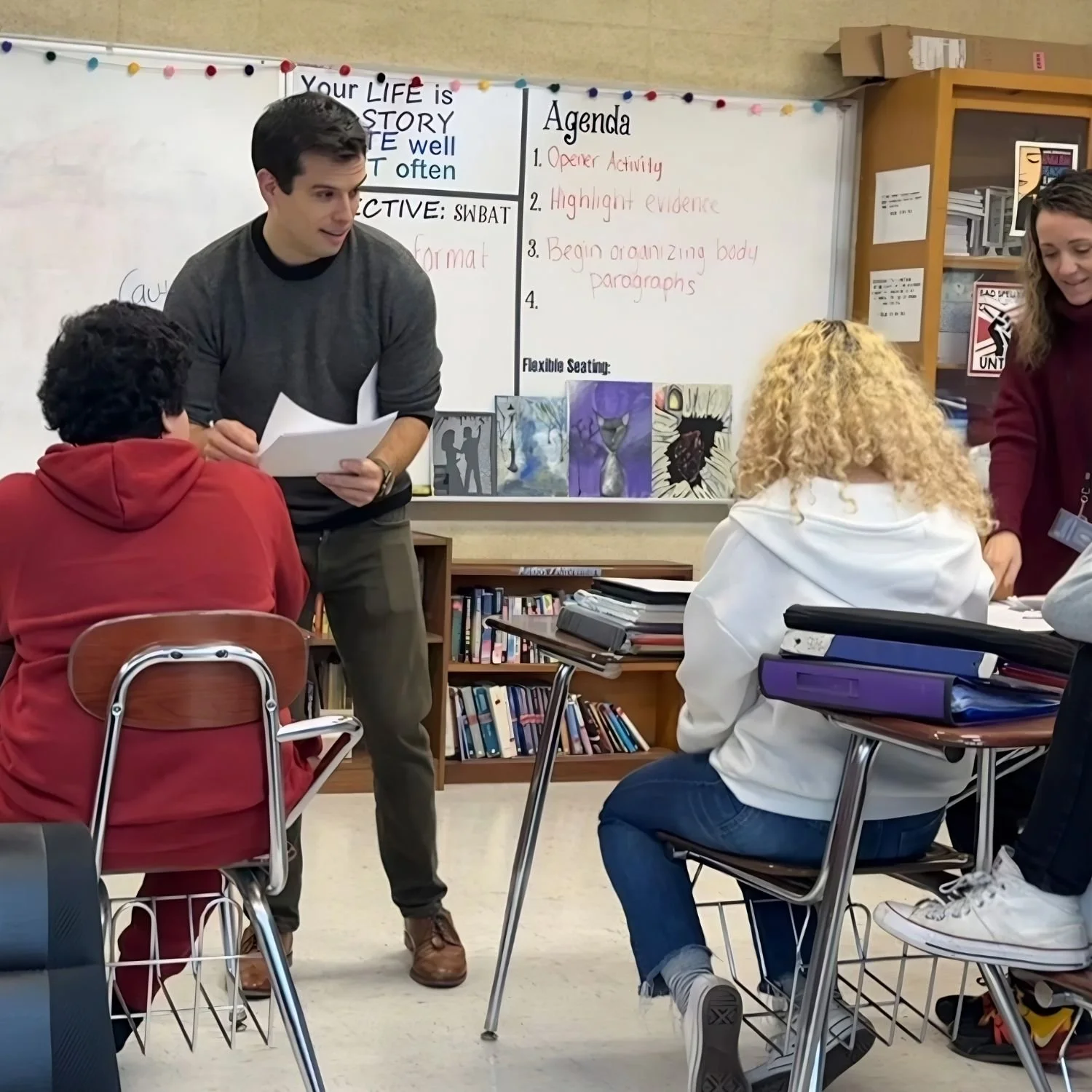 Gerrit Jones-Rooy and a teacher support students during a classroom lesson.