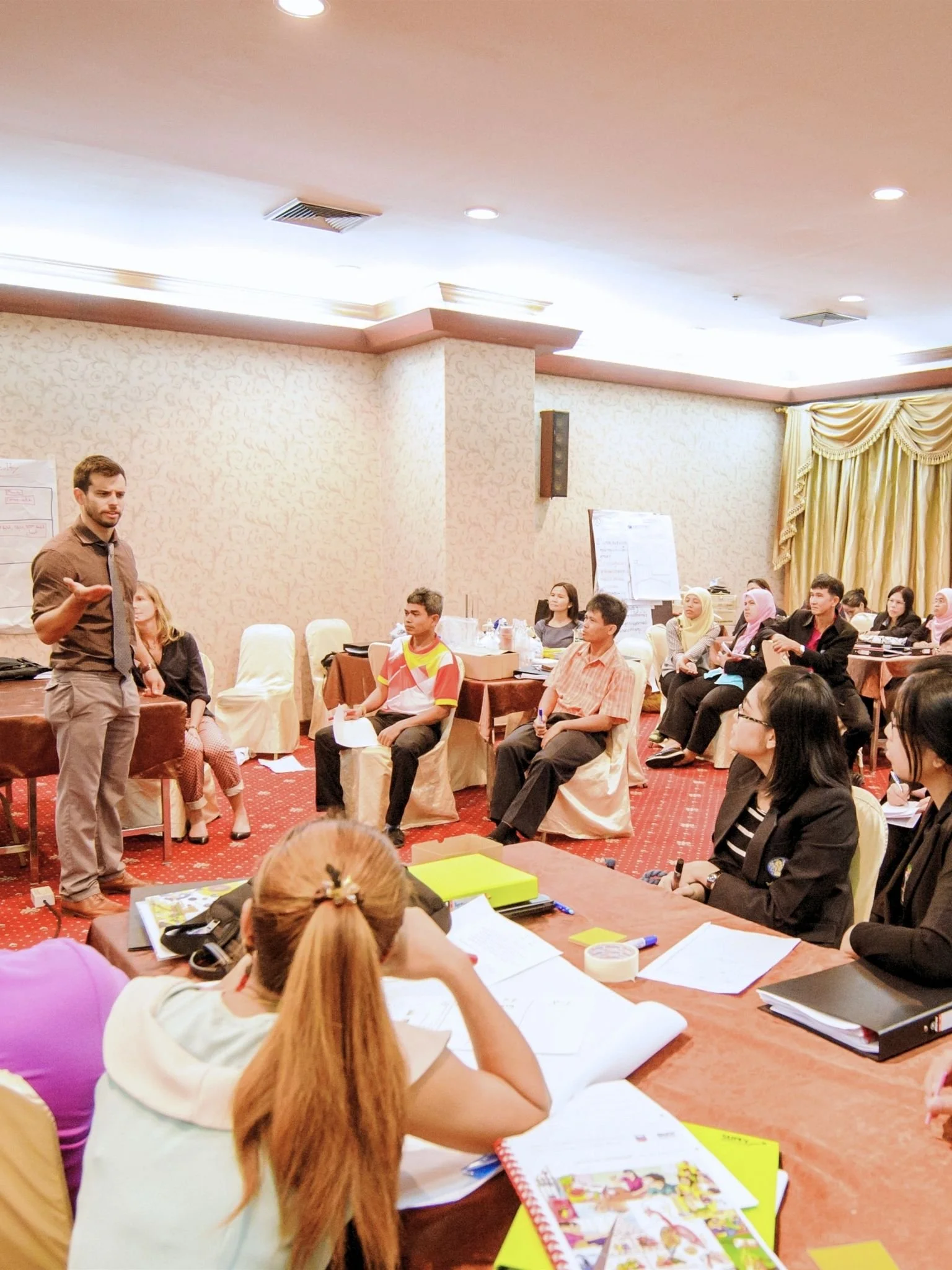 Gerrit Jones-Rooy leads a literacy workshop for educators in Thailand.