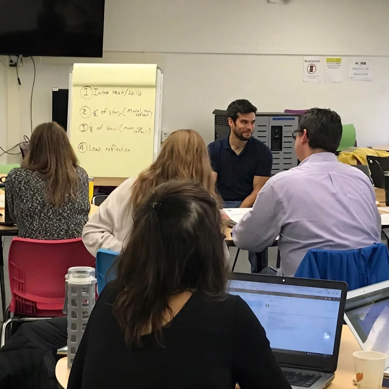 Gerrit Jones-Rooy works with educators during a small-group literacy planning session.