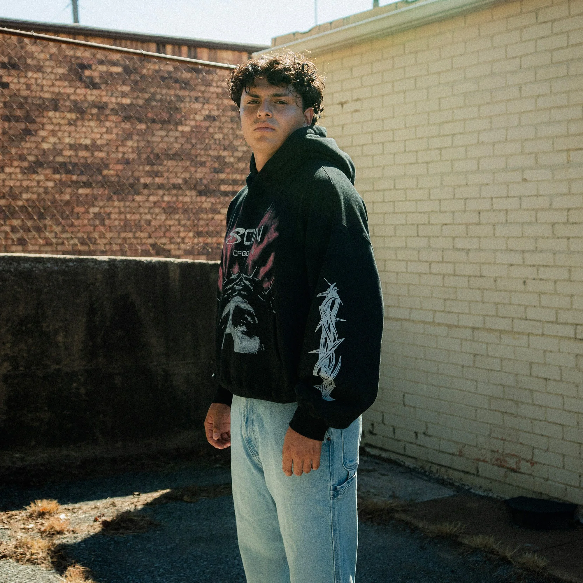 Son Of God Heavyweight Hoodie three-quarter view, worn by model