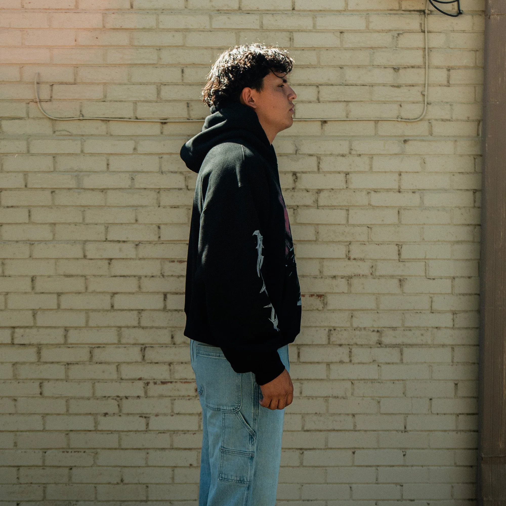 Son Of God Heavyweight Hoodie side view, worn by model