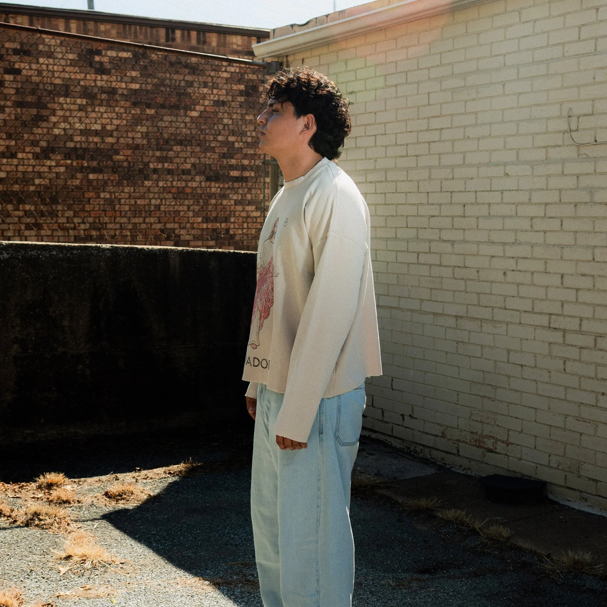 El Salvador Long Sleeve side view, worn by model
