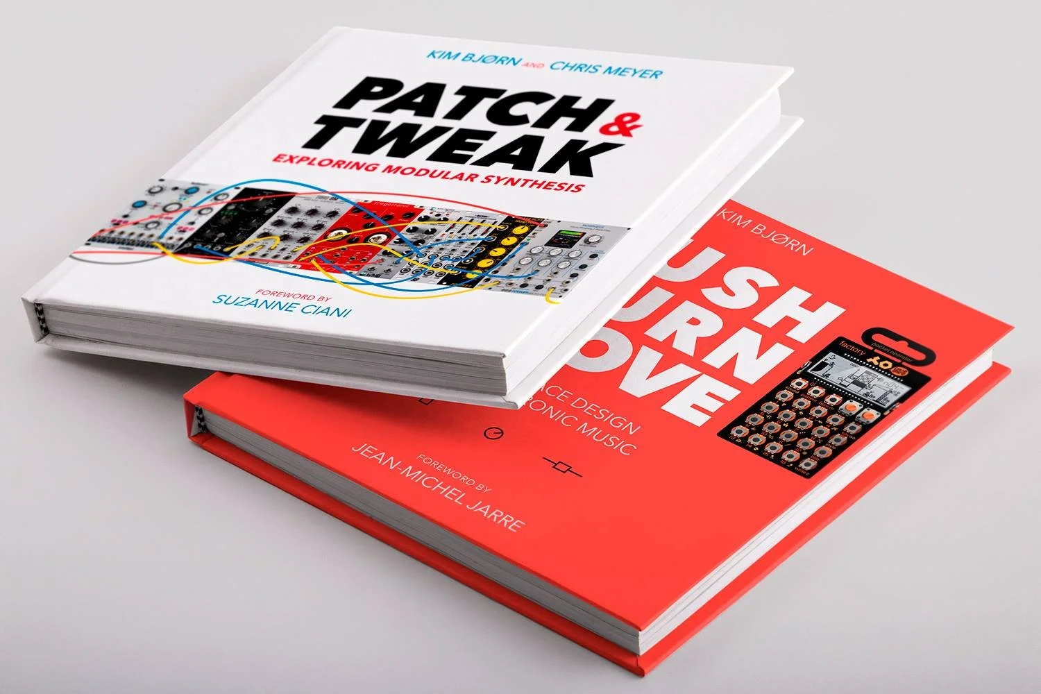 Two books on electronic music synthesis and design, one titled 'Patch & Tweak' by Kim Bjorn and Chris Meyer, and the other titled 'Push, Turn, Move' by Kim Bjorn, with a small synthesizer device featured on their covers.