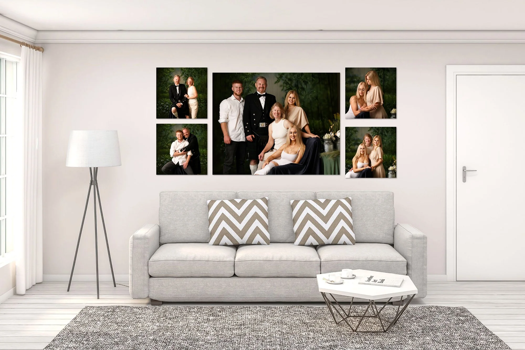 Living room with a light gray sofa, black and white chevron pillows, a white coffee table with a book and a cup, a tall white lamp, a set of five family portrait photos on the wall, and white curtains on the window.