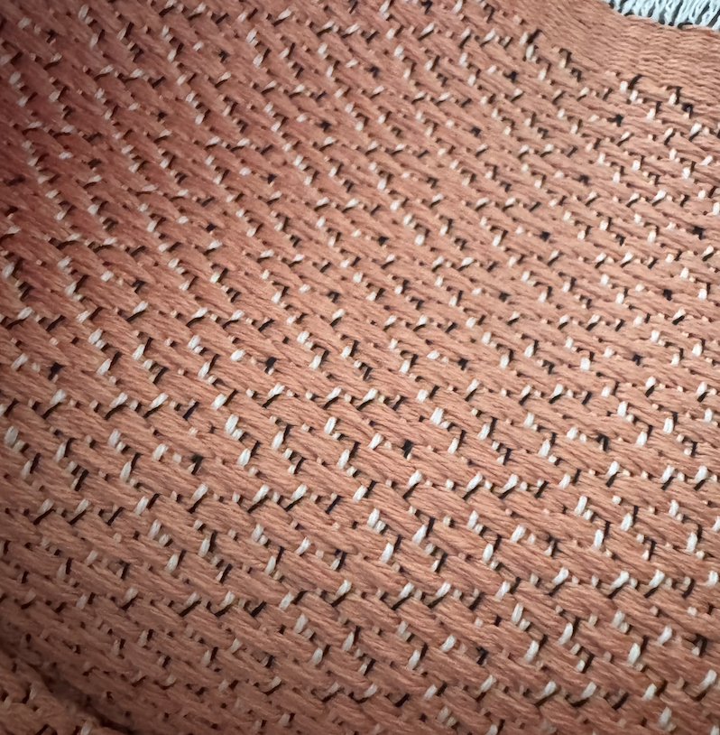 Pale Orange with Black and White Stitches 1 yard