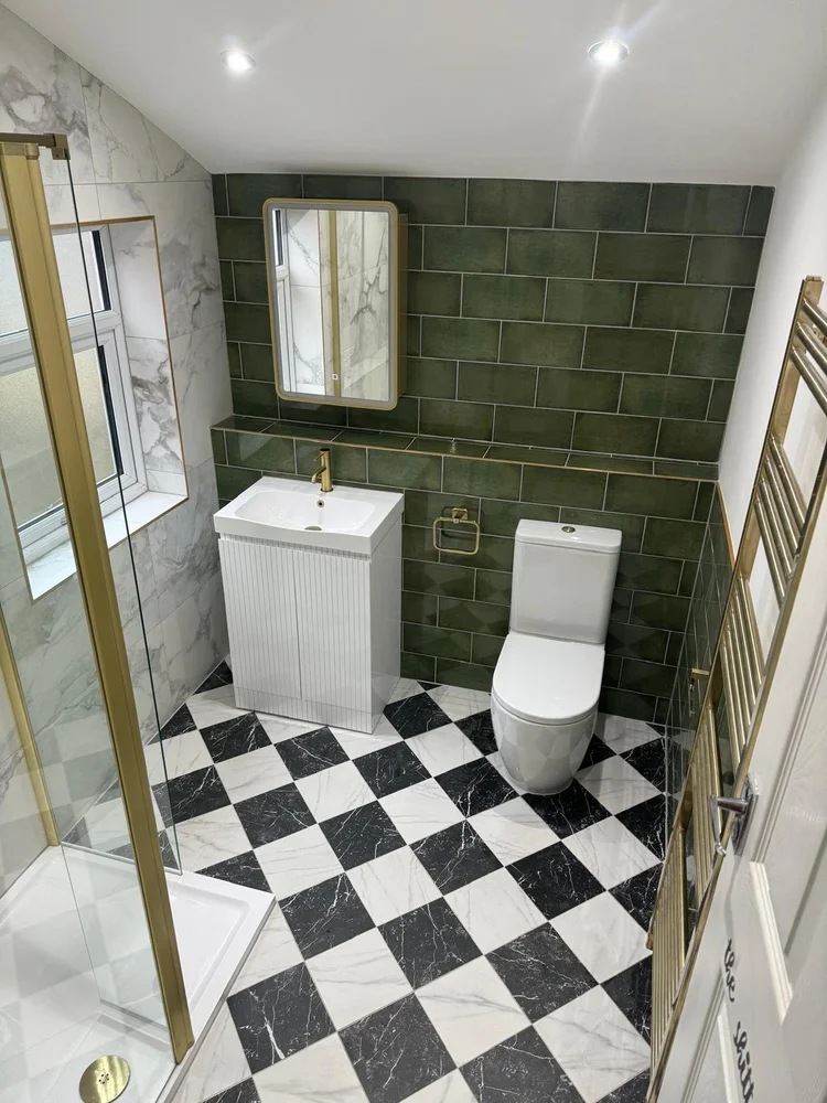 Green tile bathroom with black and white checkerboard marble floor and brass fittings — bathroom installation Nottingham