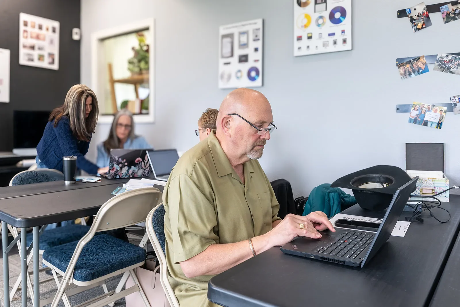 Clients Organizing Photos At a Photo Memories Preserved Workshop
