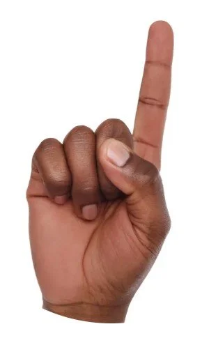 Close-up of a hand with dark skin, holding up the index finger, with the background removed.