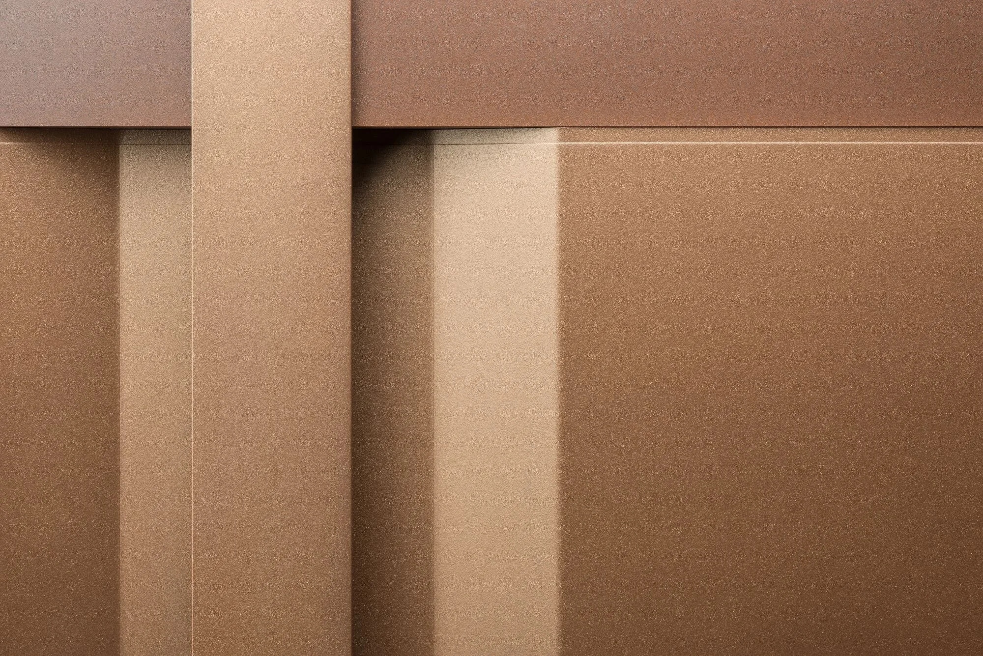 Close-up of stainless steel kitchen cabinet doors with a textured finish.