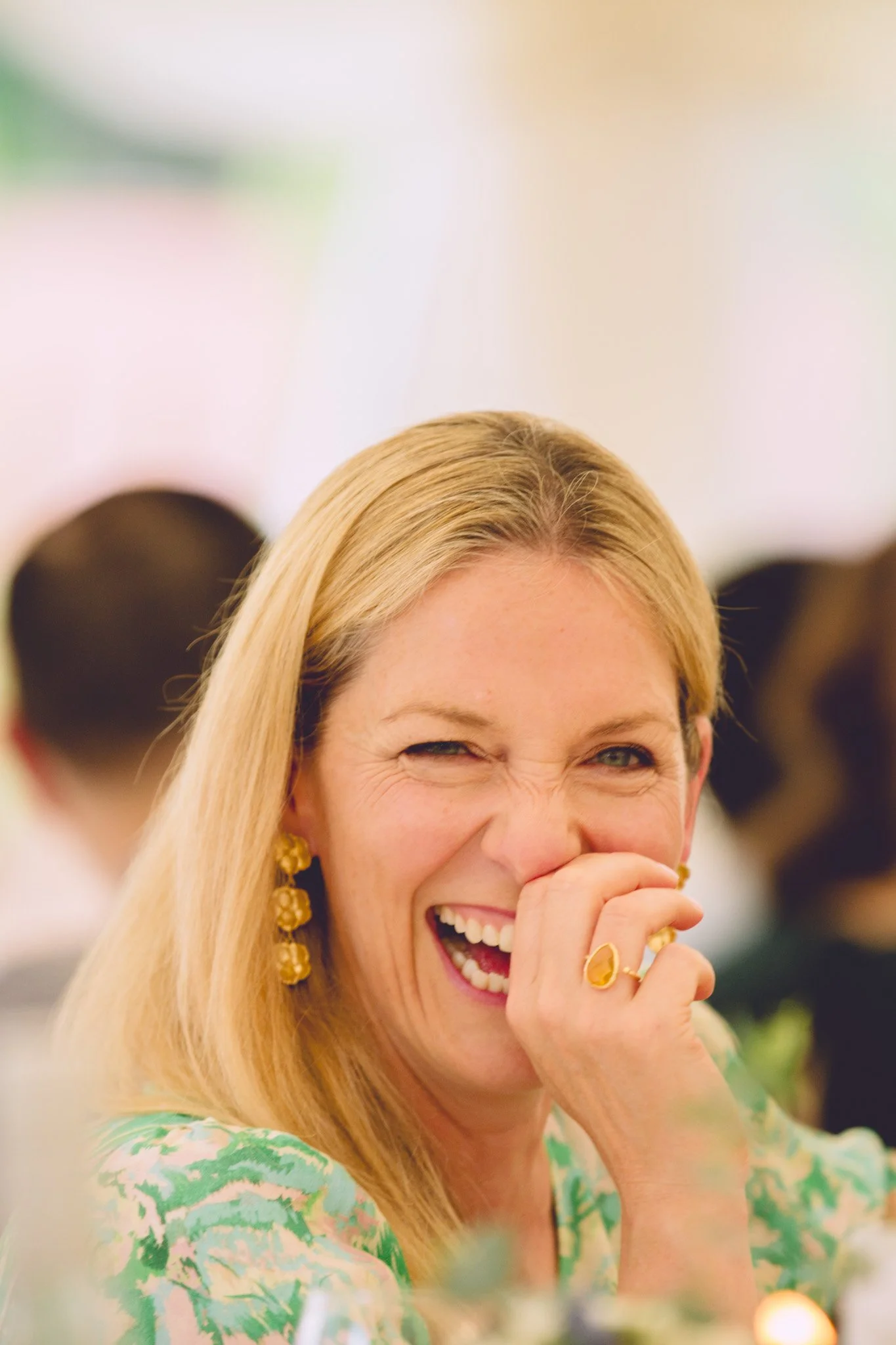 Guest laughing at a wedding reception