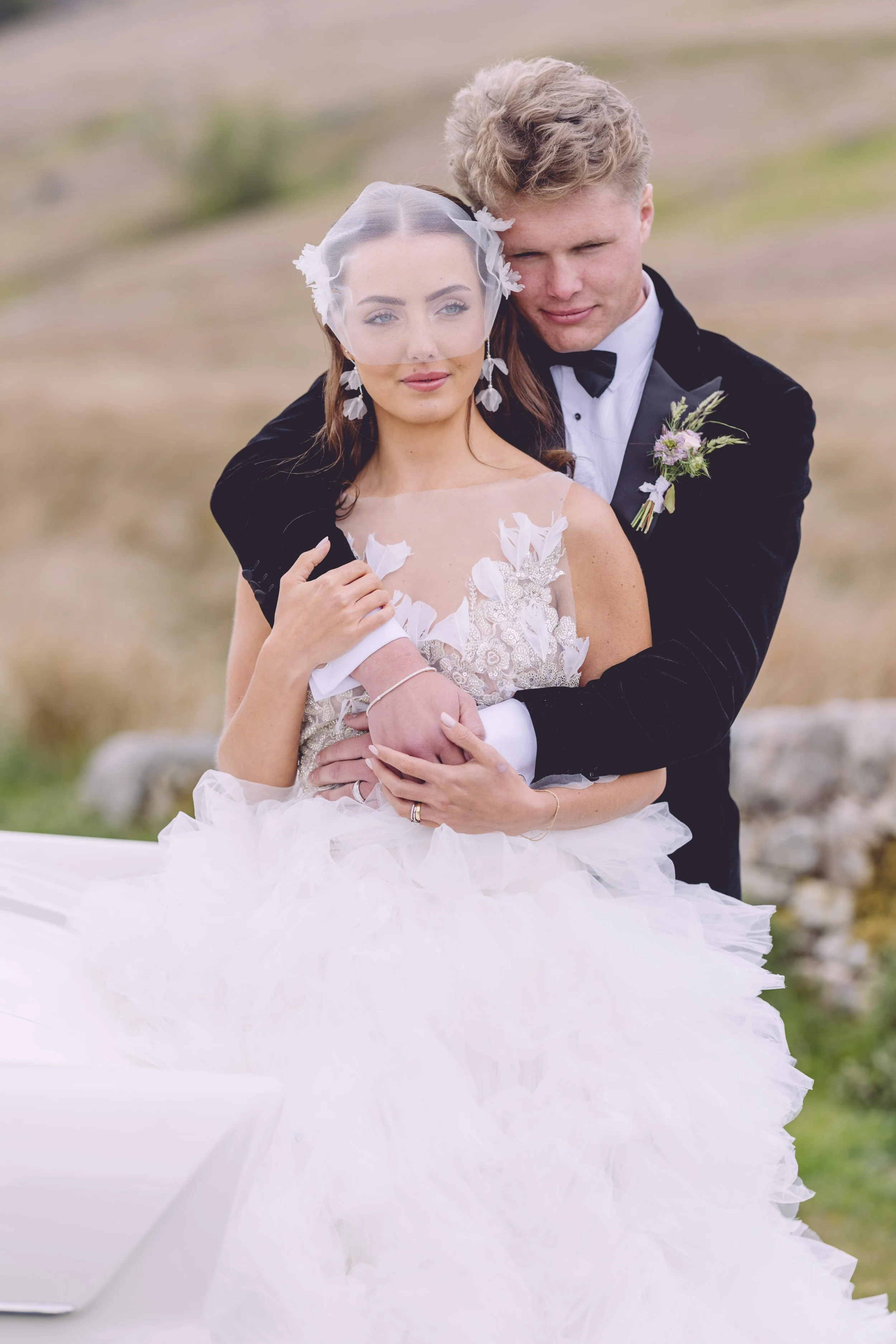 Bride and groom embrace at the Peak District