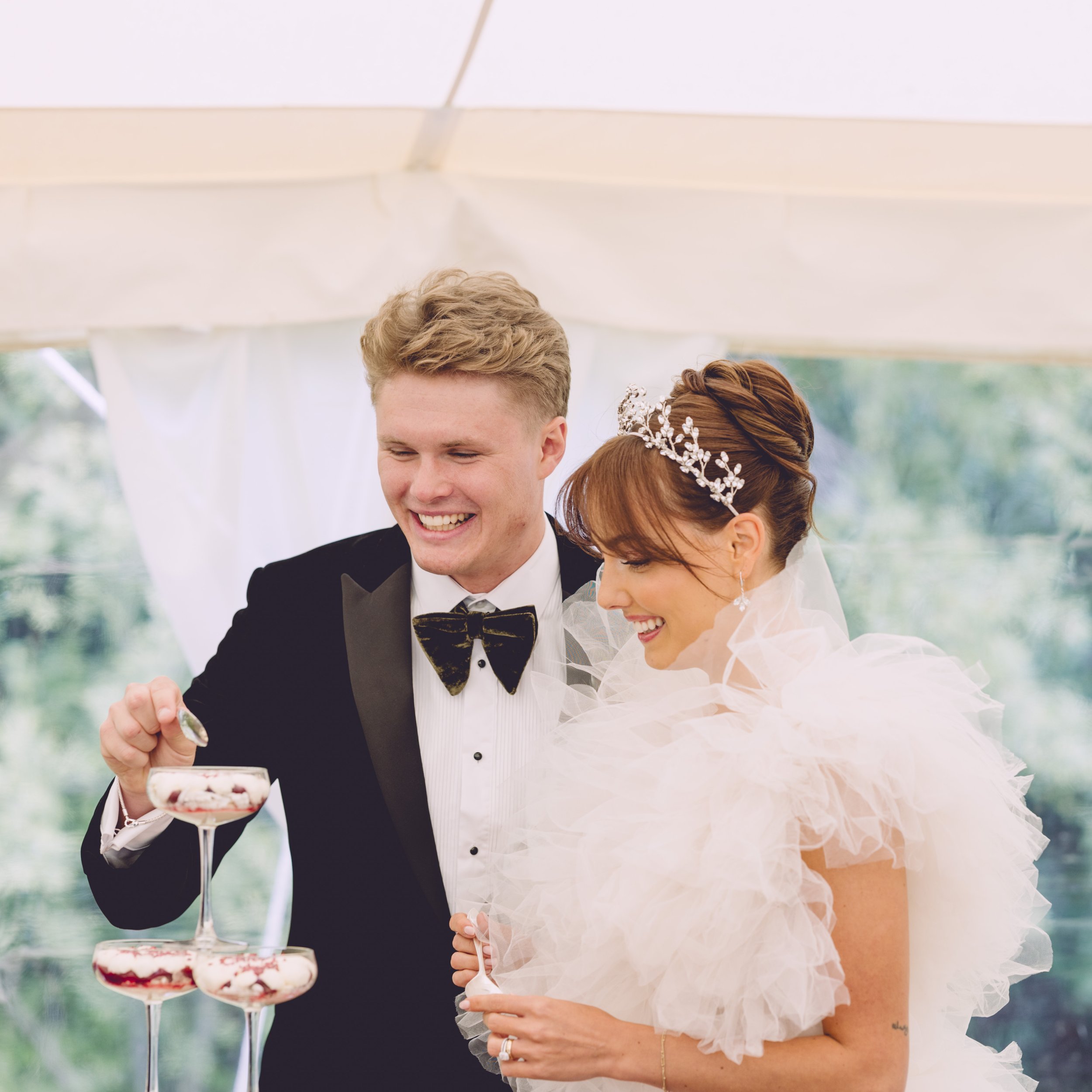 Bride & groom eating Eton mess