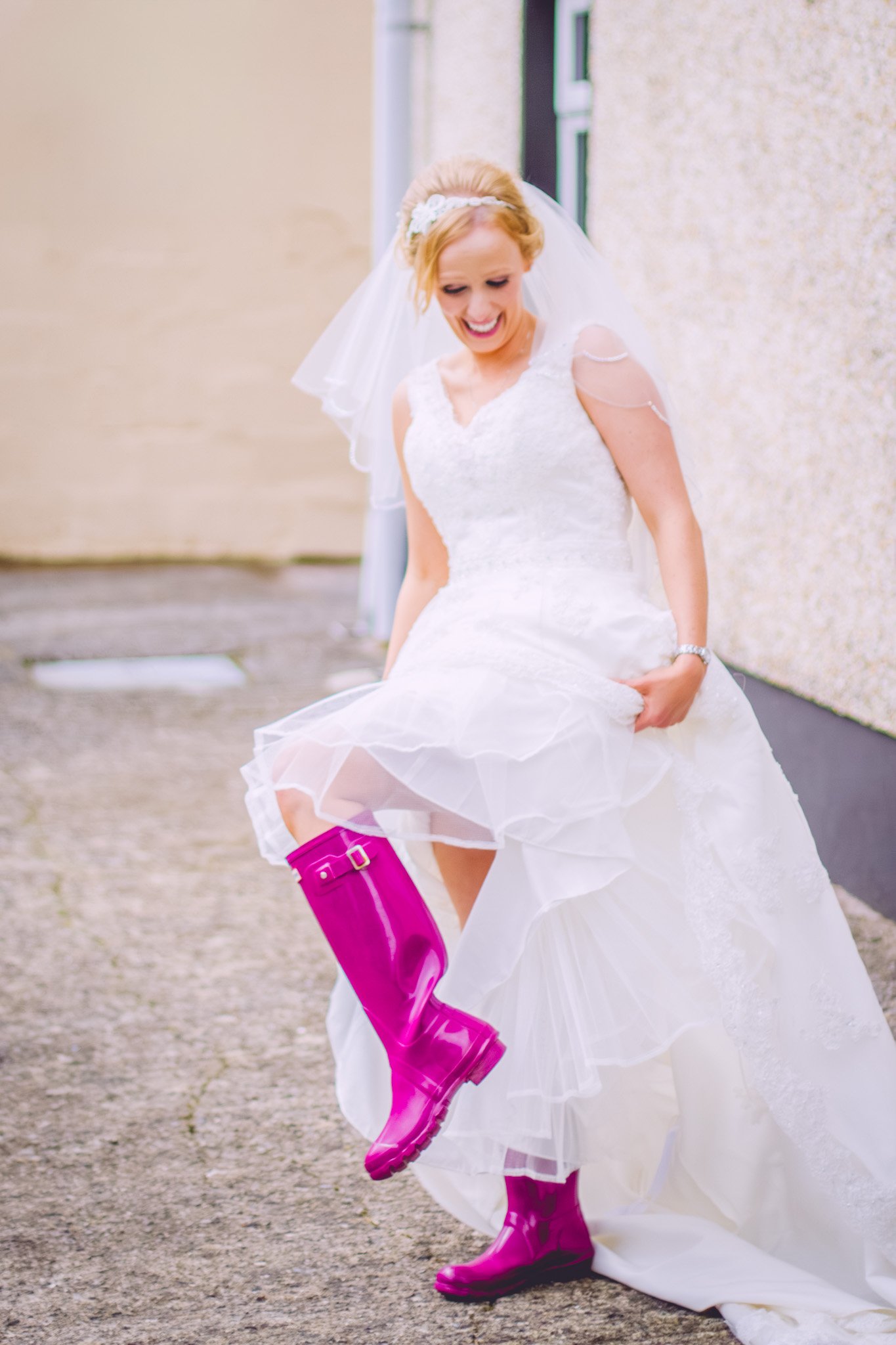 Bride wearing her pink wellies