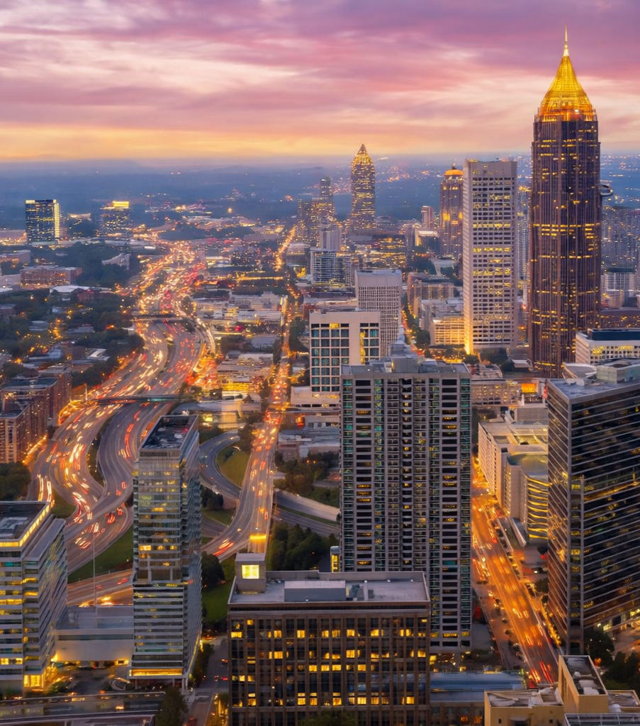 Atlanta skyline at dusk with light trails.png
