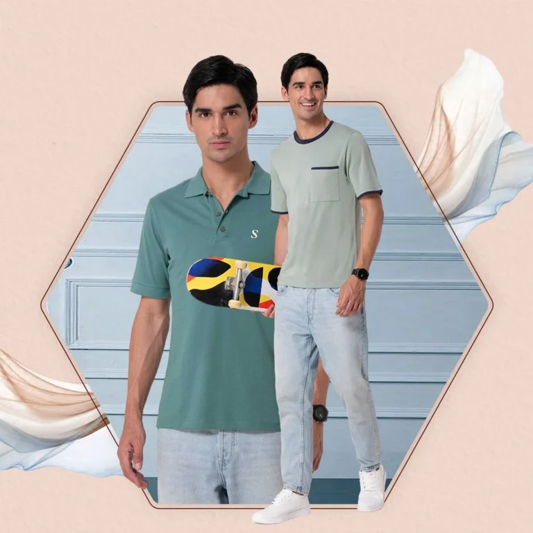 Two young men with dark hair and light skin are standing against a pastel background. One is holding a skateboard with a colorful abstract design. Both are dressed casually in T-shirts, light-wash jeans, and white sneakers. The overall vibe is casual and modern.