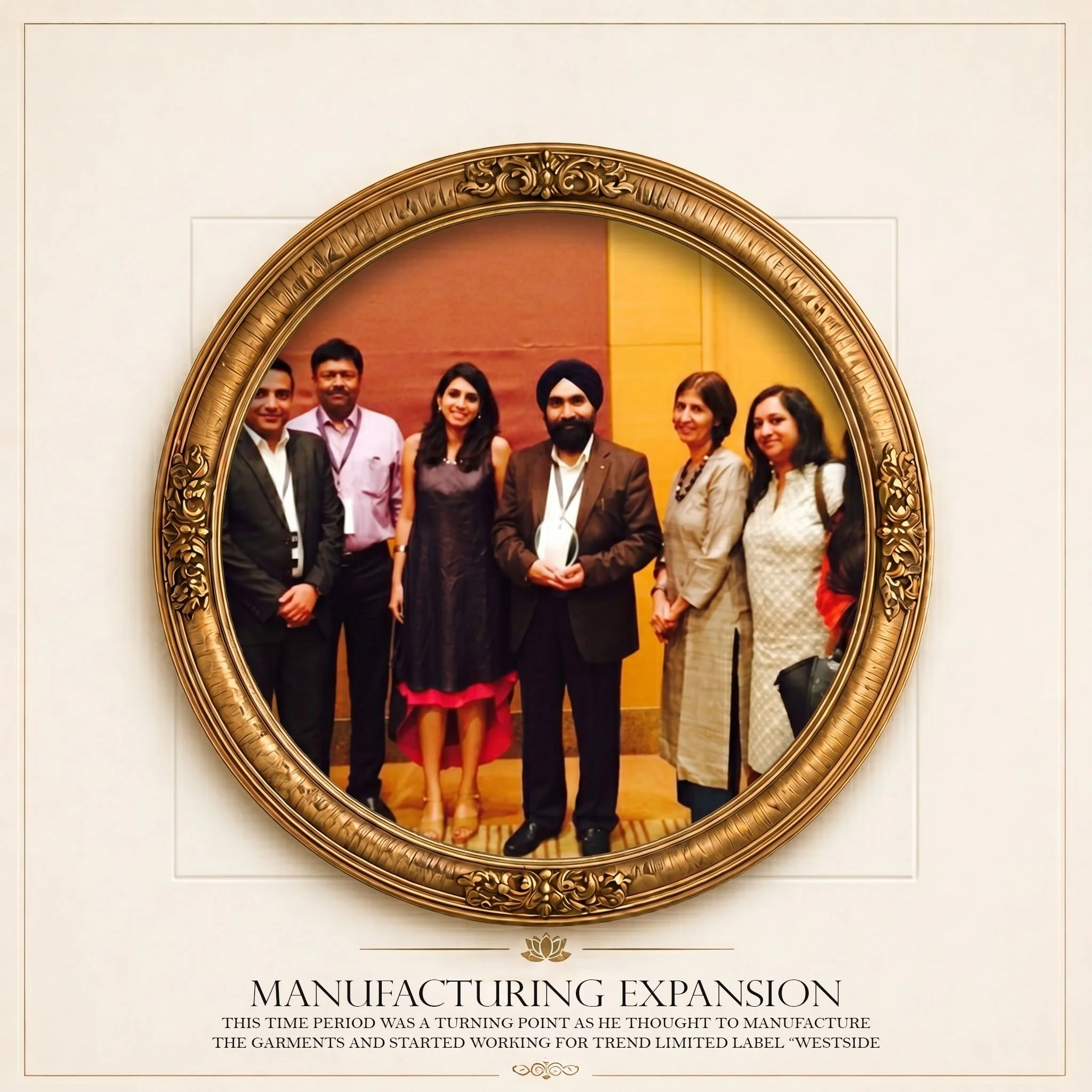 A group of men and women standing together inside a dance studio or conference room. They are dressed in formal and semi-formal attire and are smiling. The setting appears professional or celebratory. The photo is framed with a decorative, ornate gold-colored border.