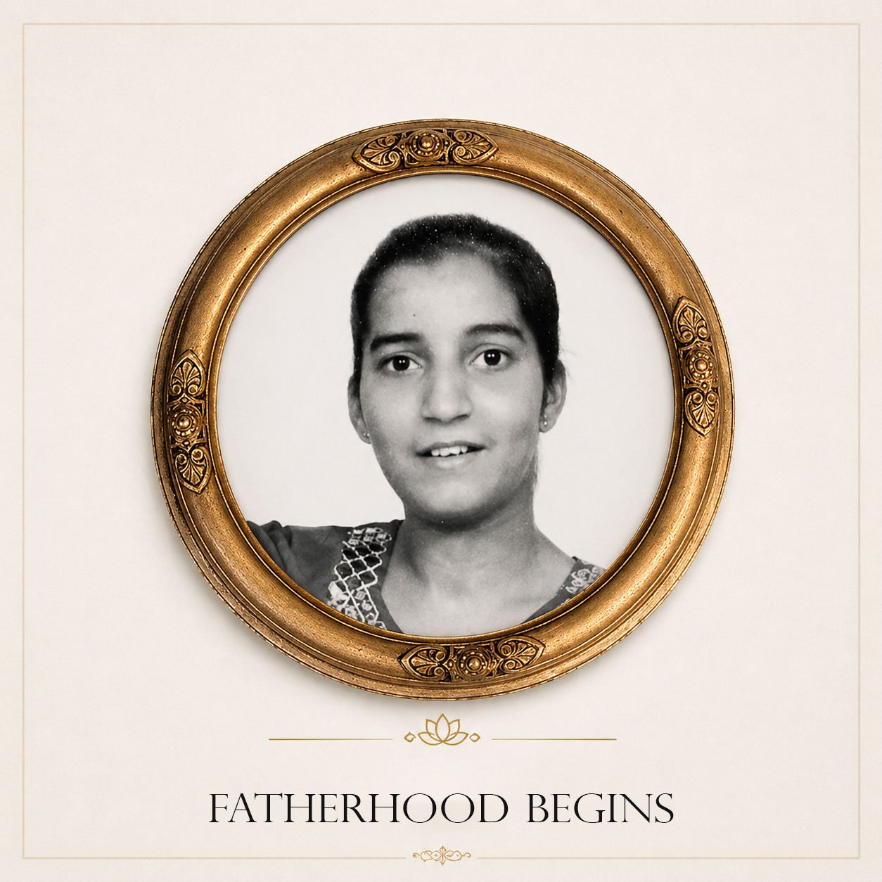 Black and white portrait of a woman with a gentle smile, framed in an ornate, gold oval frame, with the words "Fatherhood Begins" written beneath.