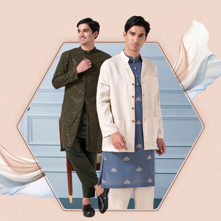 Two men dressed in traditional and modern Indian clothing posing indoors with a blue wall background.