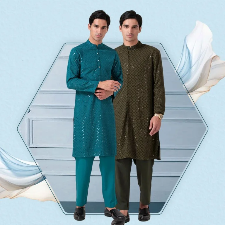 Two men standing side by side in traditional South Asian ethnic wear, one in a blue kurta and churidar, the other in a brown kurta and pants, on a light background with decorative drapes.