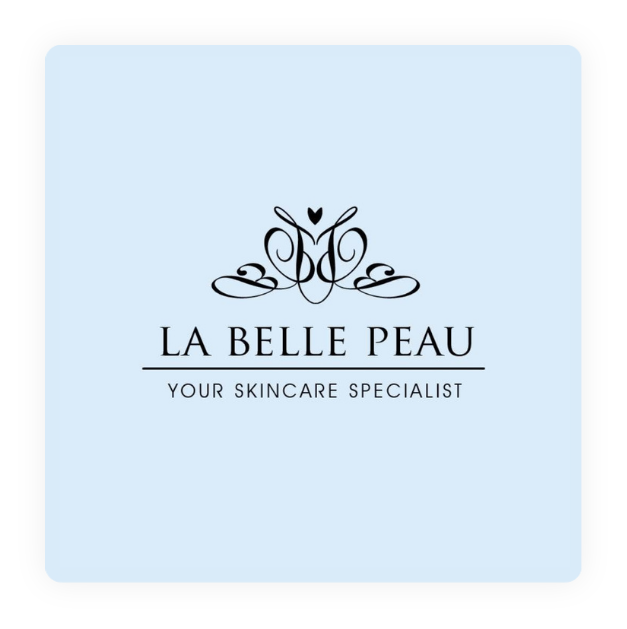 Logo for La Belle Peau skincare with a decorative black design, gray text, and a light blue background.