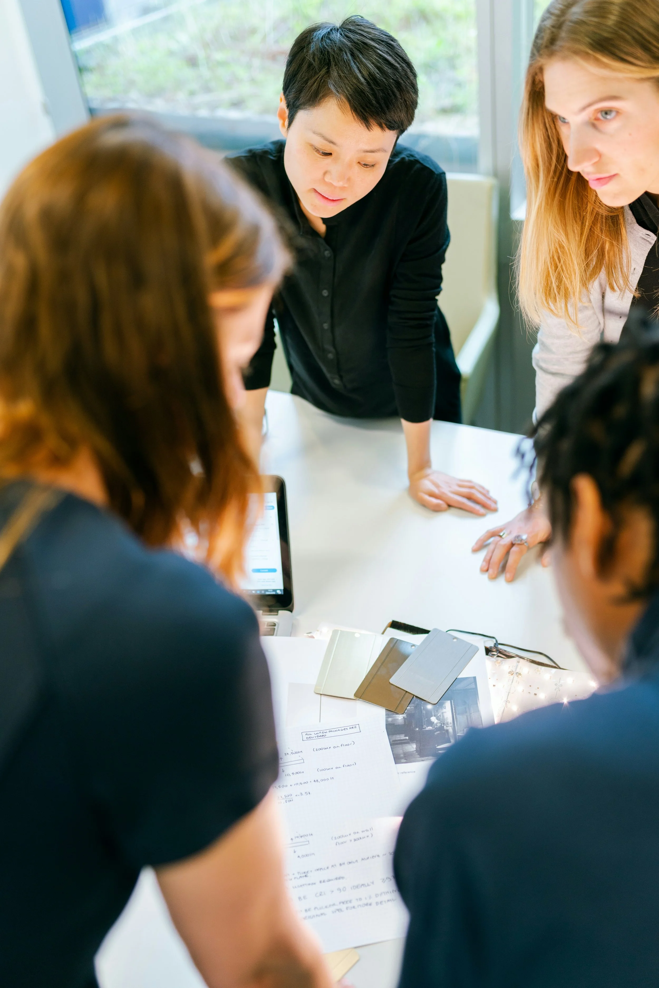 A team working on some papaers on a office table