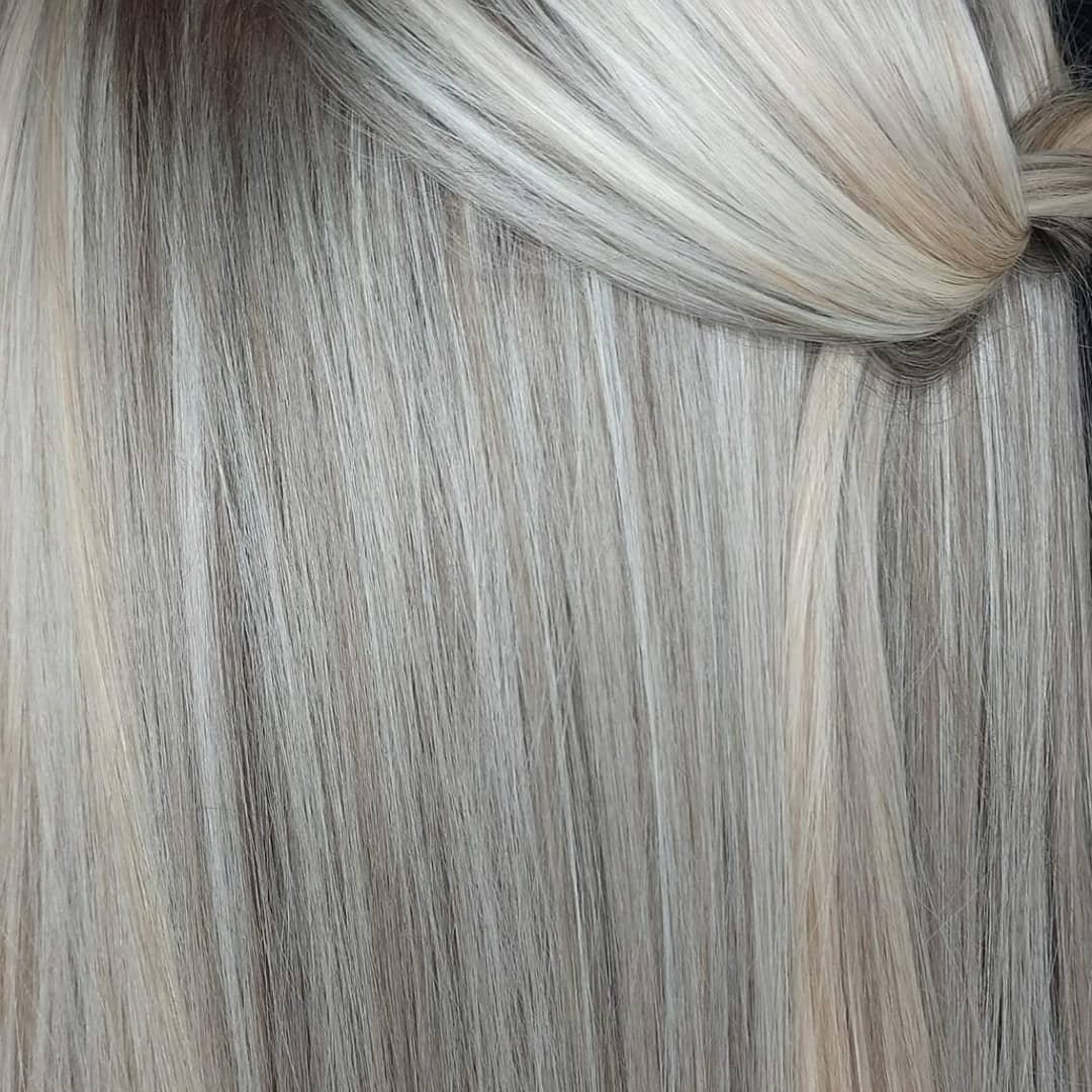Close-up of straight, platinum blonde hair.