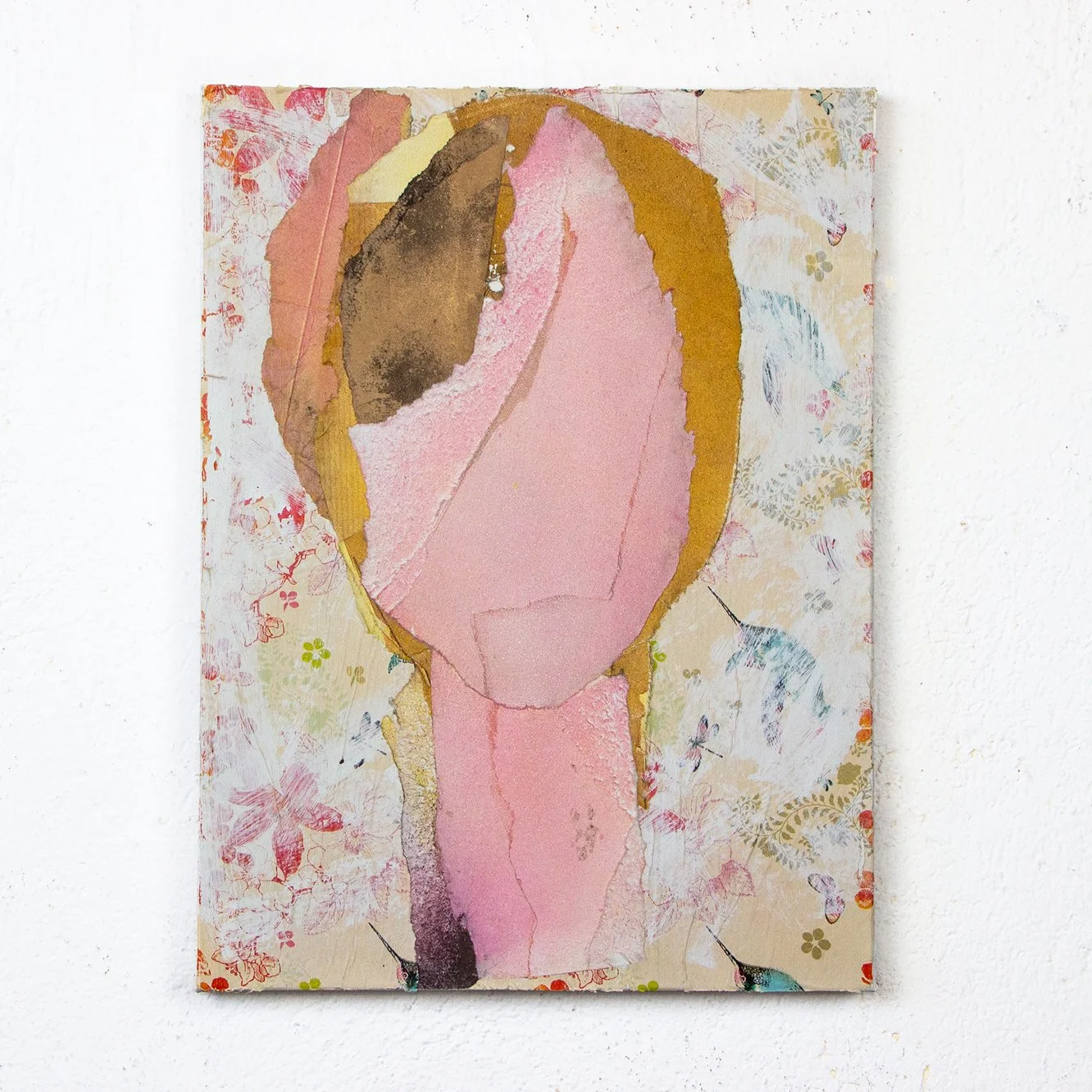 Abstract collage art on canvas featuring a stylized person with a large pink face and neck, surrounded by colorful textured paper and floral patterns.