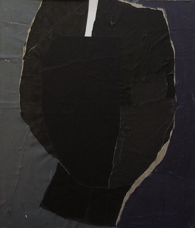 Close-up of a collage made from torn black paper pieces with edges of beige paper, resembling an abstract face or mask.