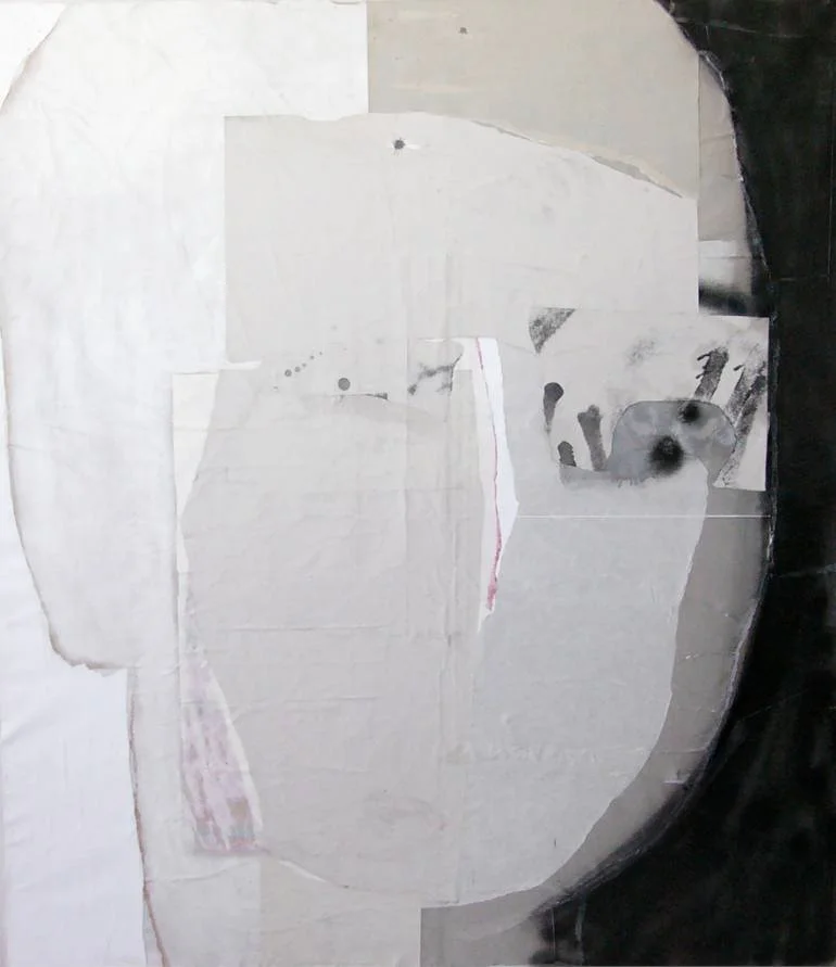 A collage of torn paper pieces arranged to form an abstract face shape on a dark background.