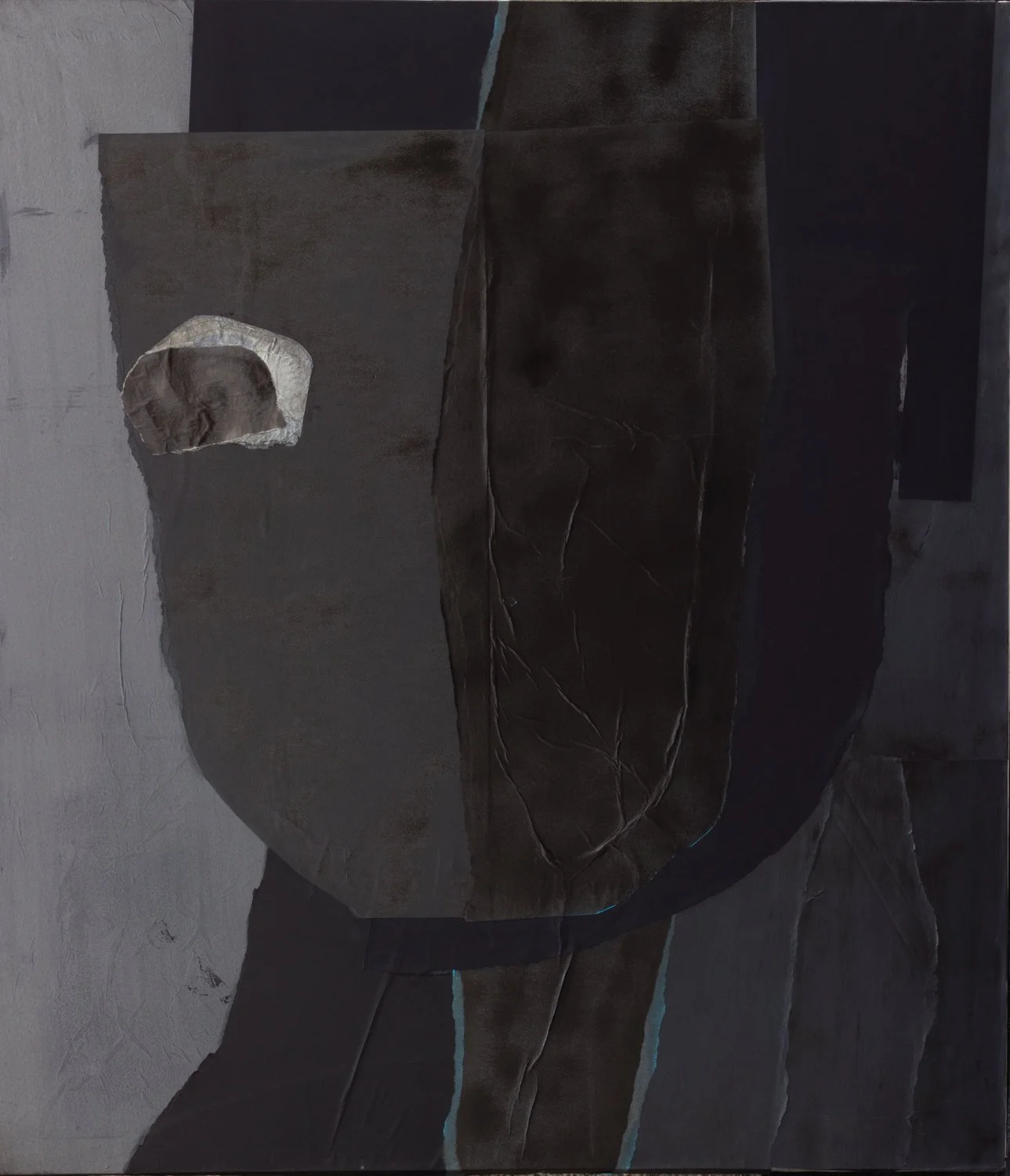 Abstract artwork featuring a dark face with a skull on the left side and blue accents.