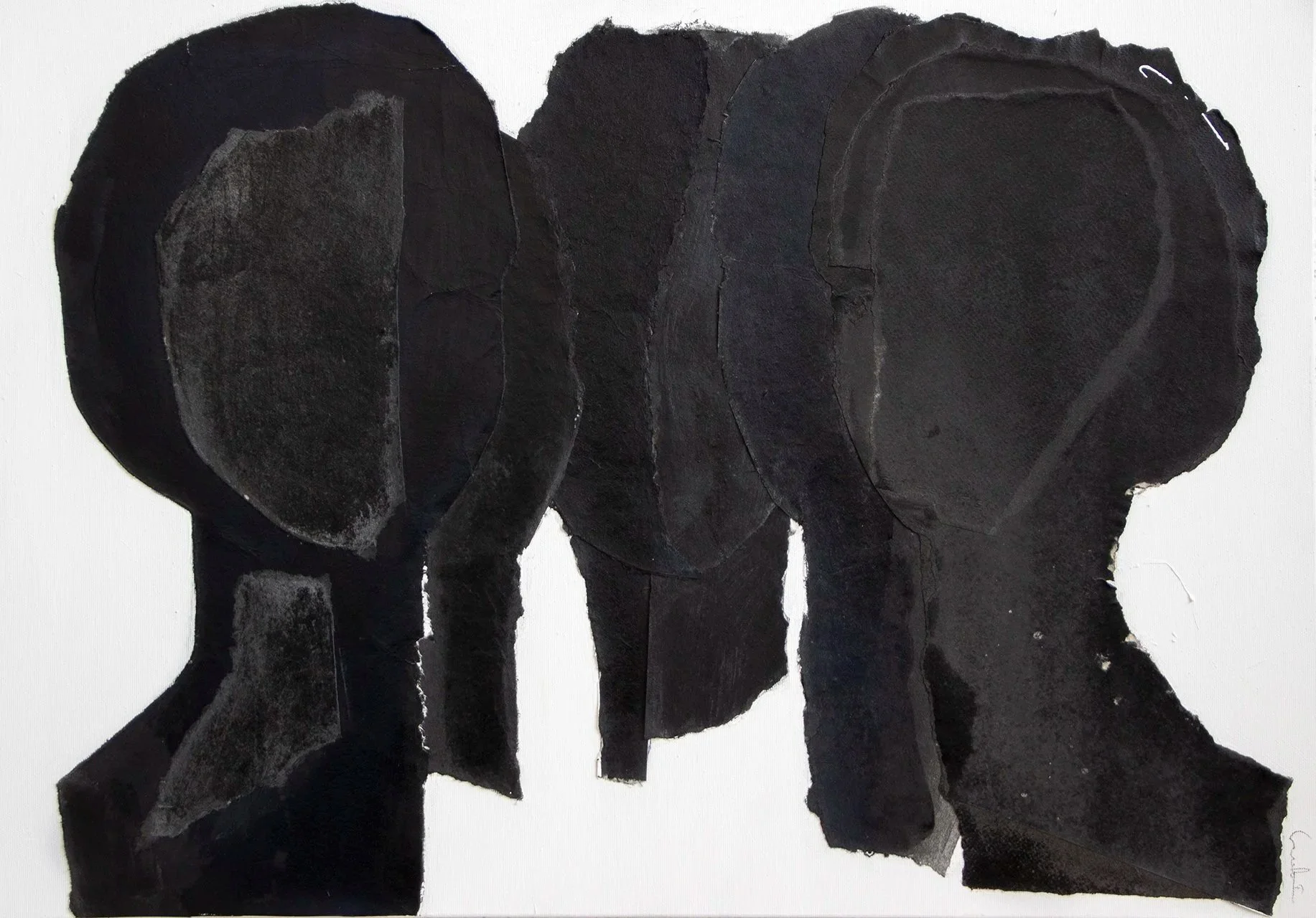 Collage of black and dark gray pieces arranged to form the shape of an elephant.