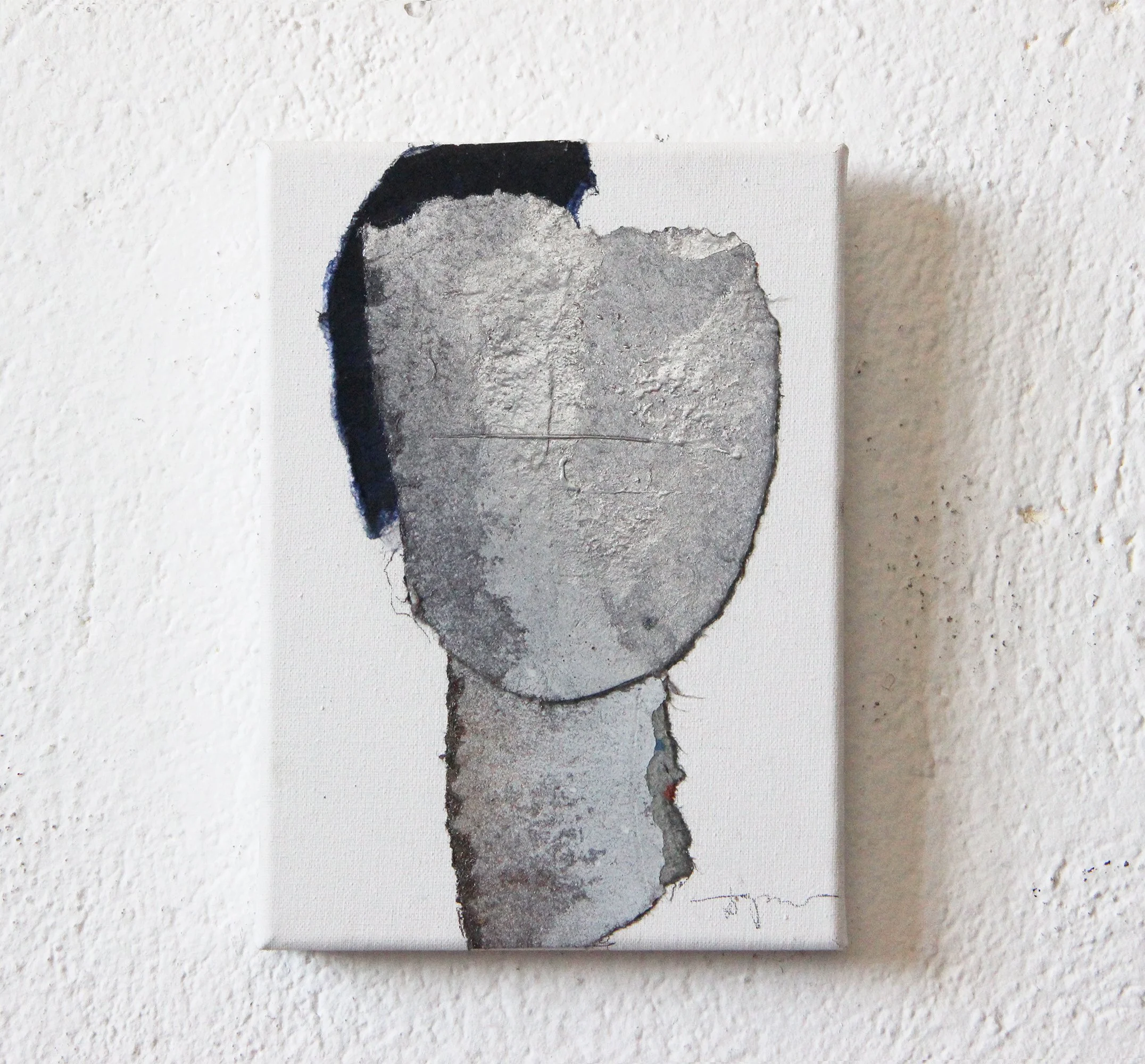 Abstract artwork depicting a faceless figure with a fractured, textured gray head and a black patch on the left side, on a white background.