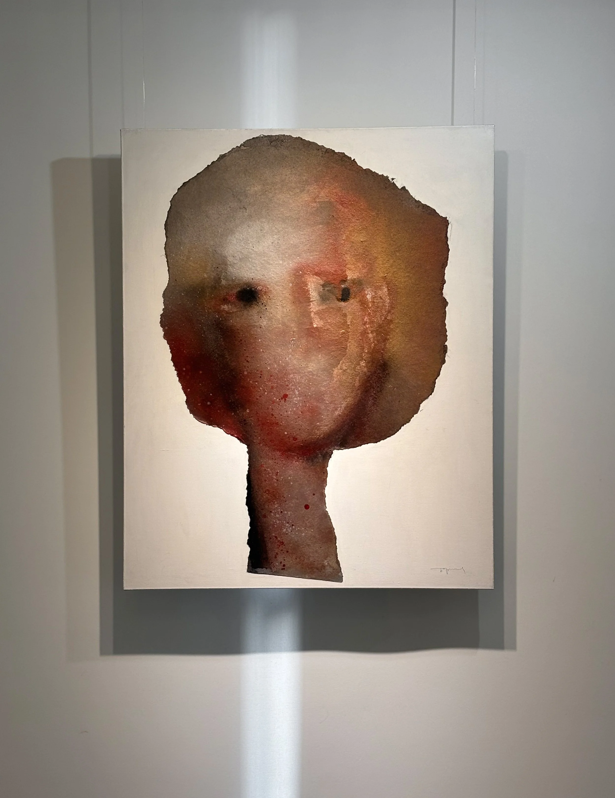Abstract watercolor painting of a person's face with dark hair, set against a neutral background.