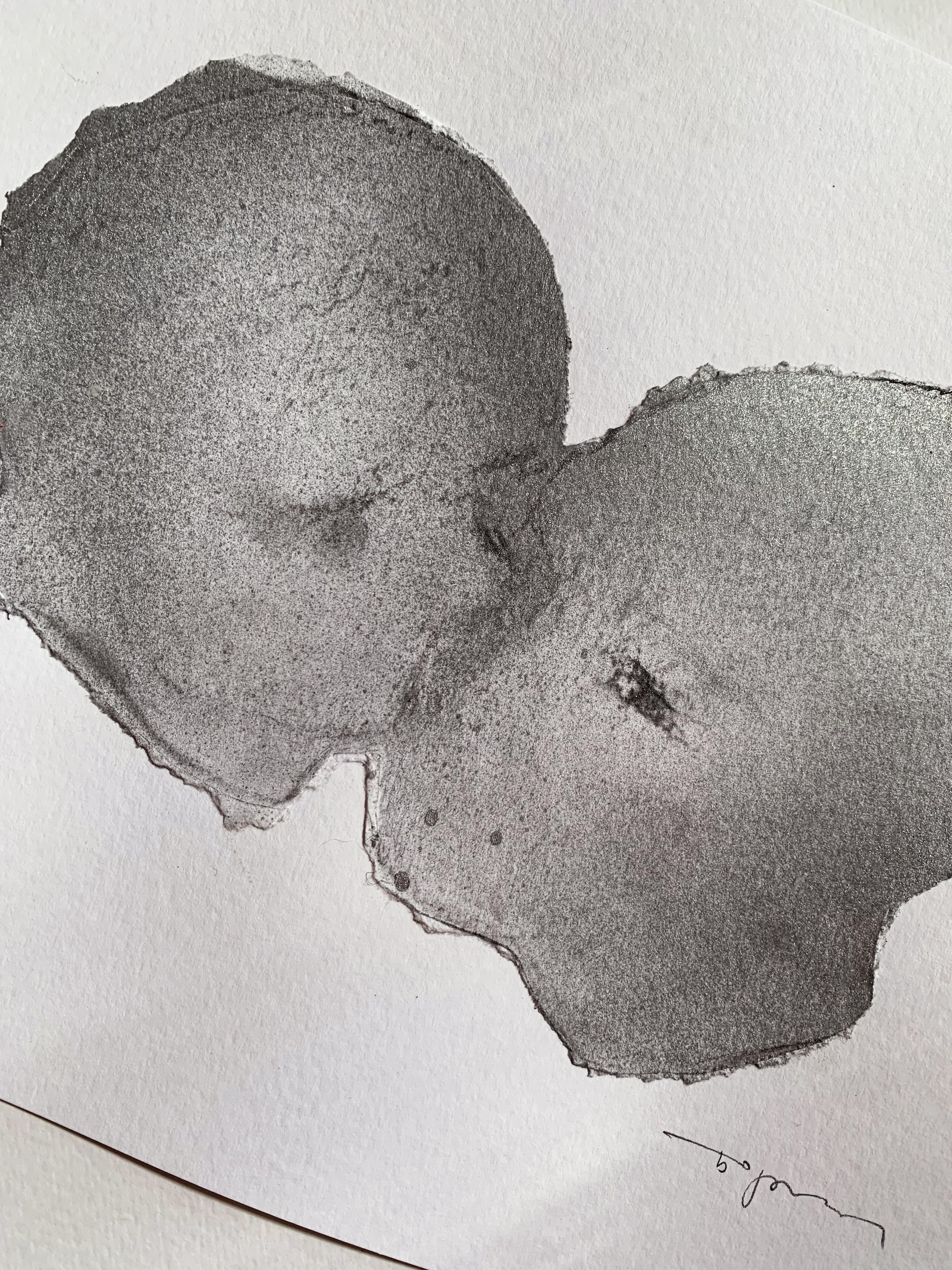 Abstract black and white ink drawing of two rounded shapes with textured shading and a faint signature in the bottom right corner.