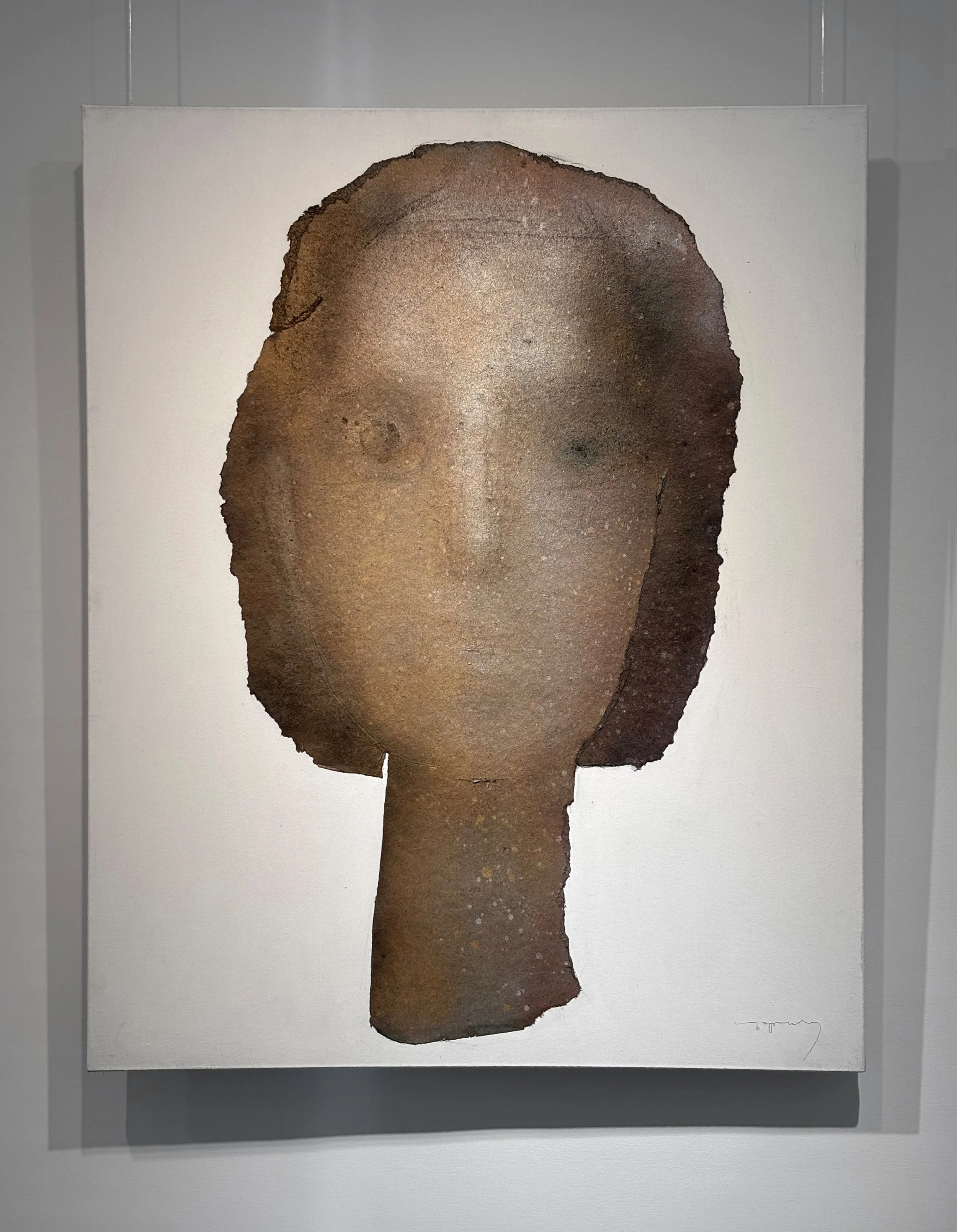 Abstract artwork of a woman's face with short hair, created with textured brown and neutral tones on a white background.