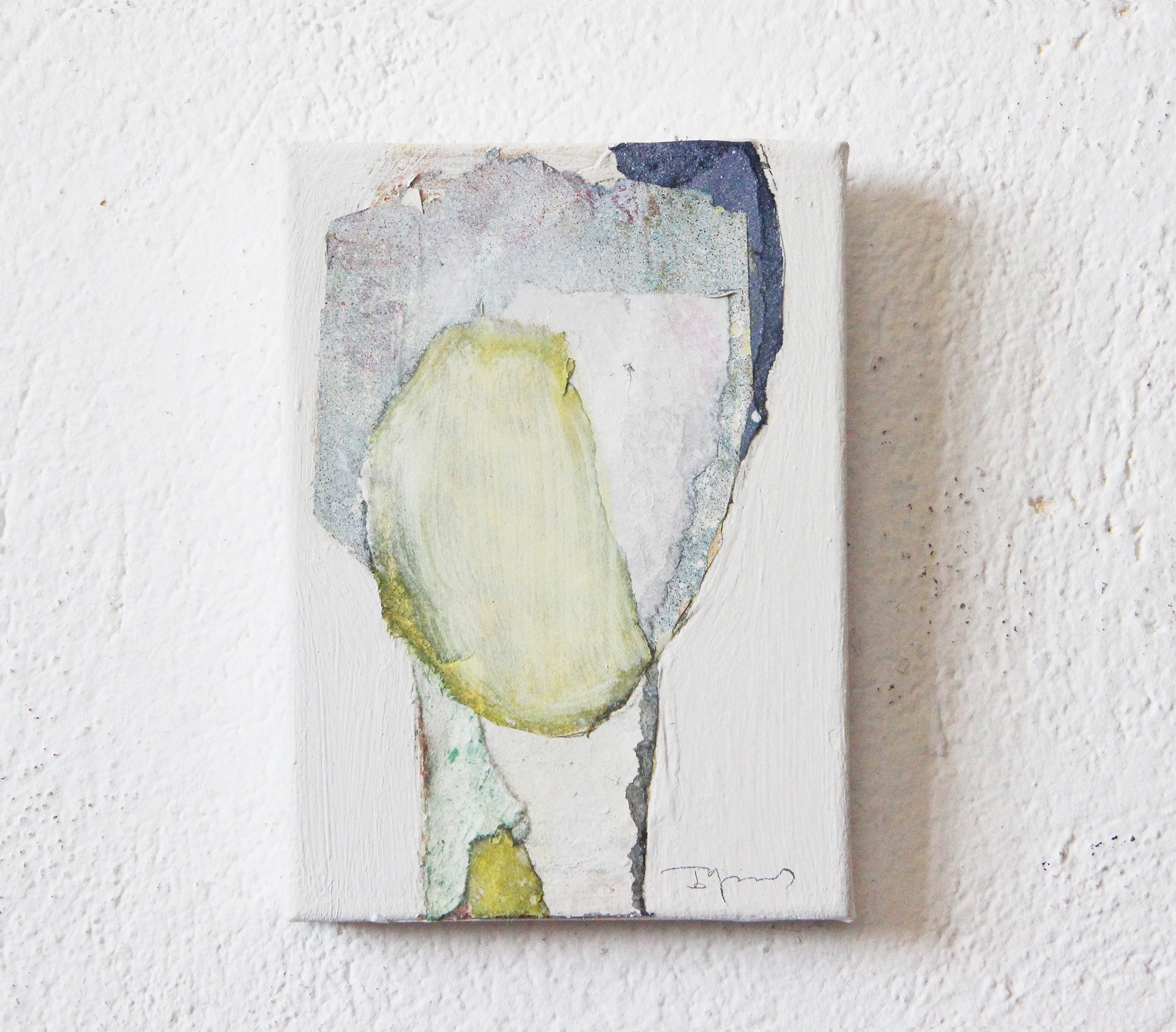 Abstract watercolor painting on a small stretched canvas featuring shades of green, yellow, gray, and blue, and signed in the bottom right corner.