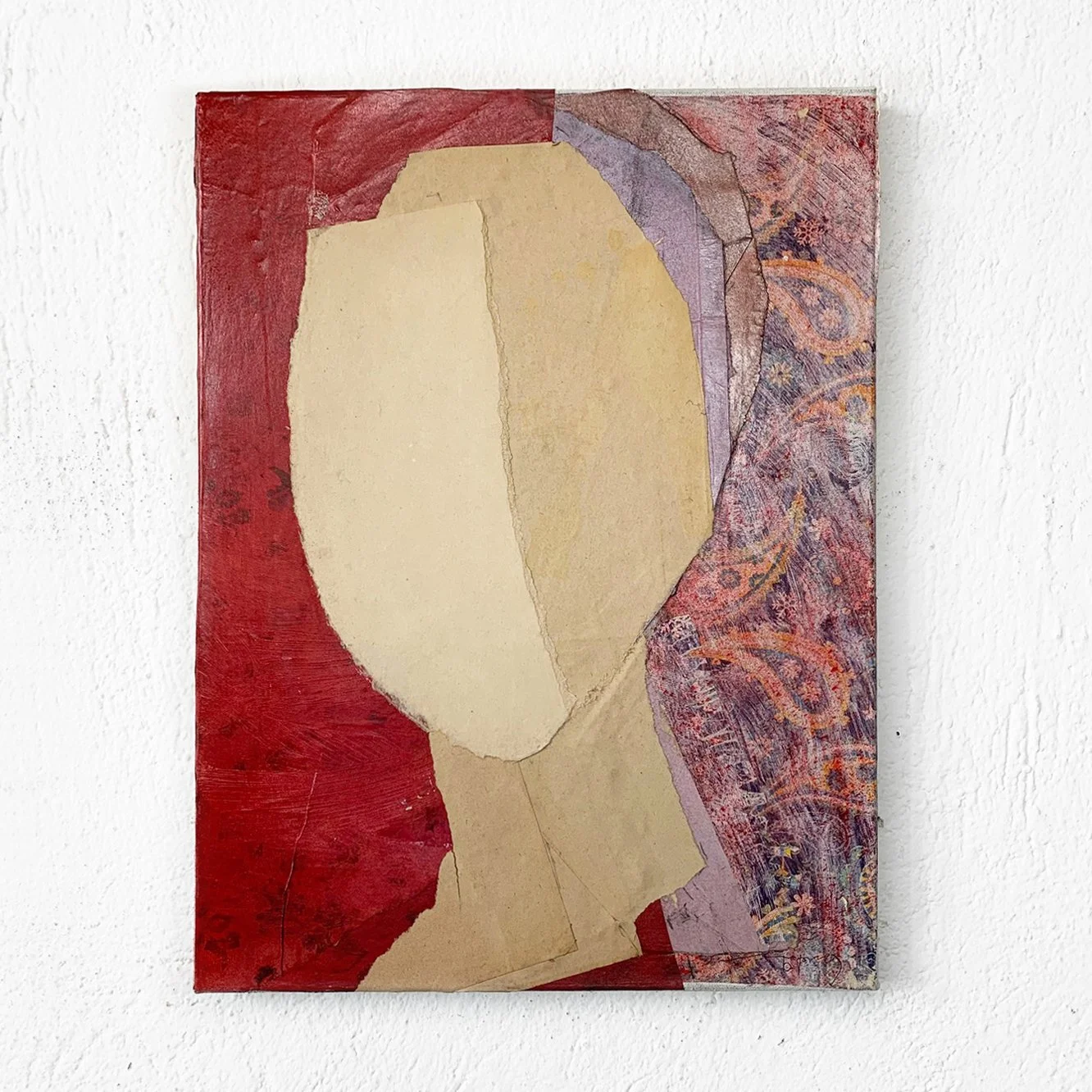 Abstract art collage with a profile of a face in beige, set against a red background and patterned purple and pink details.