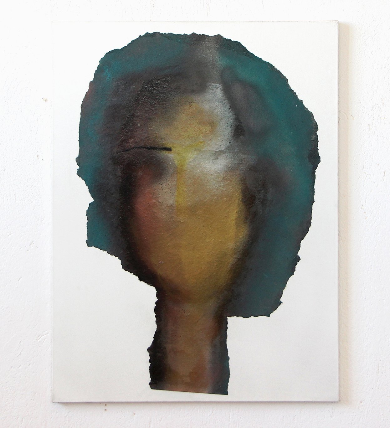 Abstract watercolor painting of a woman's face on canvas, with short dark hair, on a white wall.