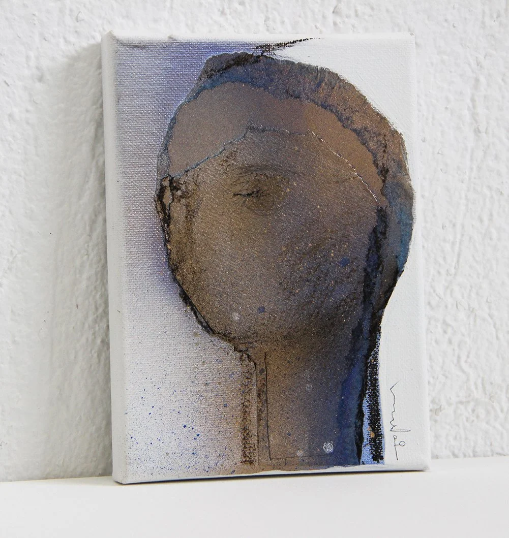 Abstract art depicting a partial human face on a small canvas, with textured and layered paint in earthy tones and hints of blue.