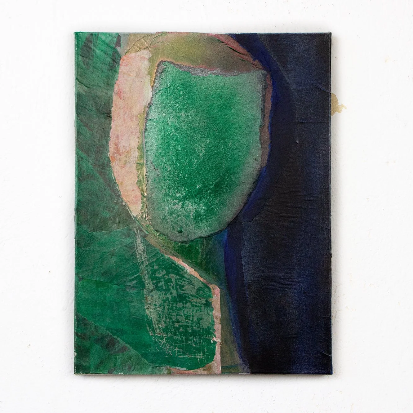 Abstract painting with green, pink, and dark blue colors on canvas