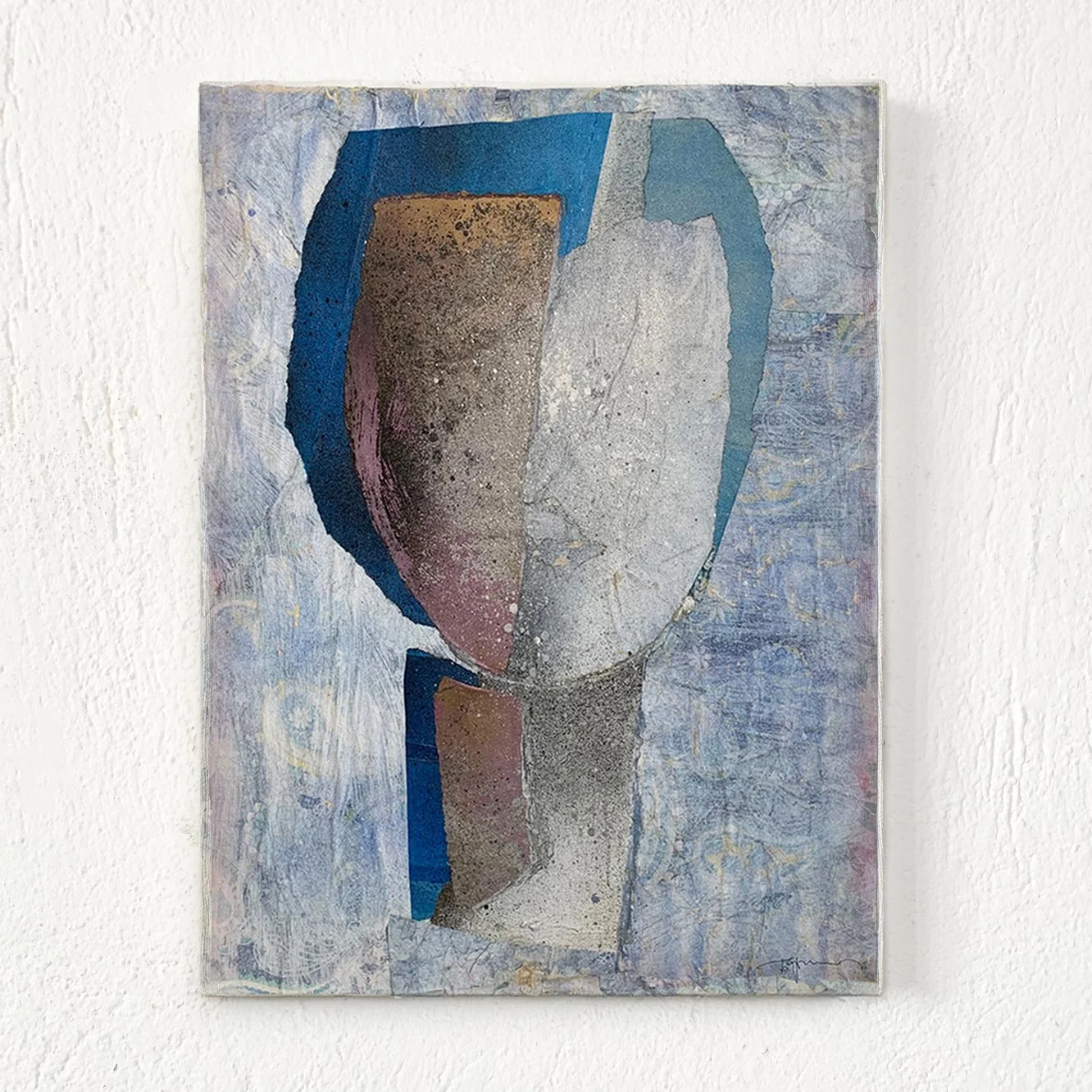 Abstract painting of a stylized face on canvas, using geometric shapes and textured surface in shades of blue, gray, and brown, mounted on a white wall.