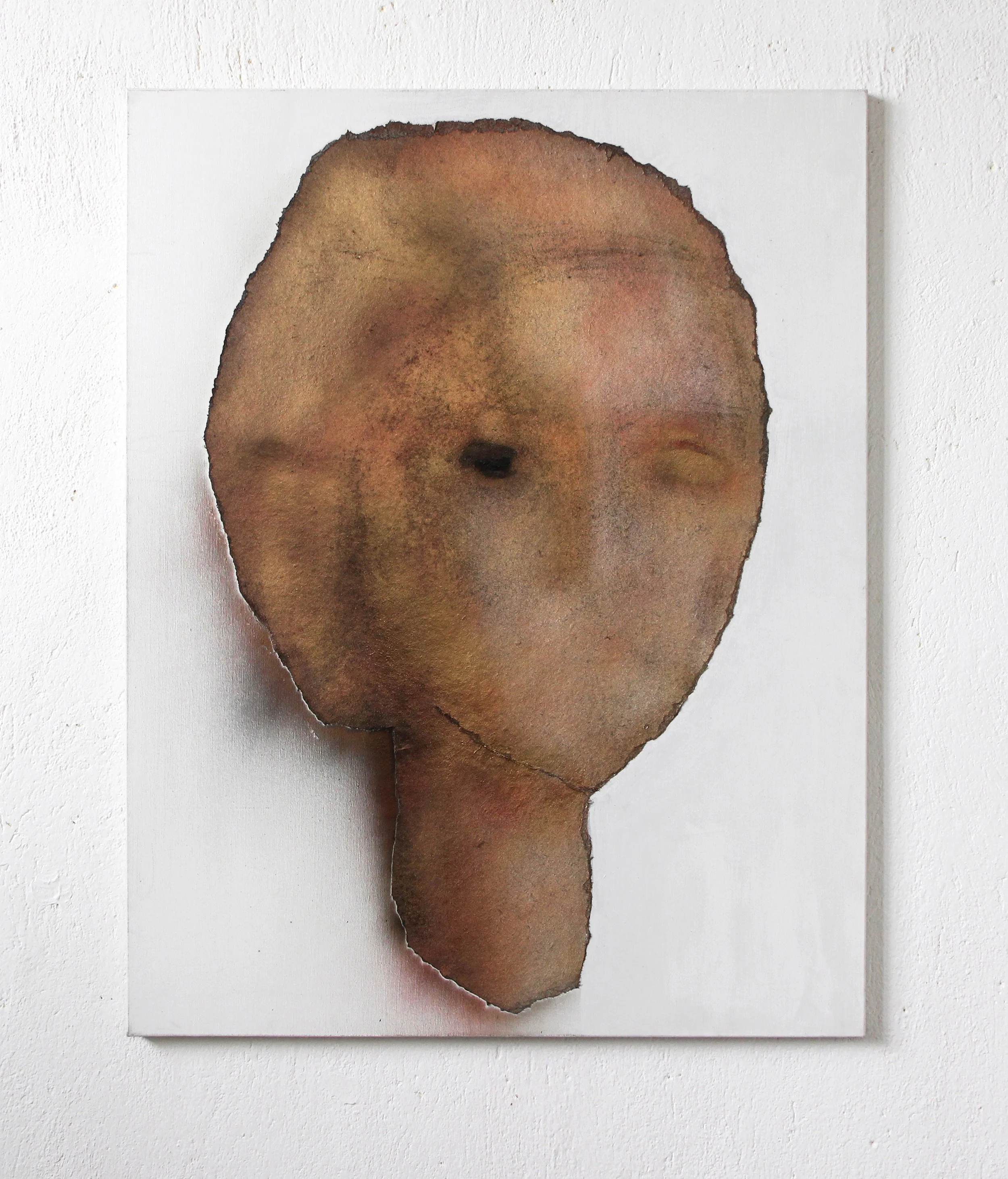 Artwork of a humanoid face with a neck, created with watercolor on torn paper, mounted on a white background.