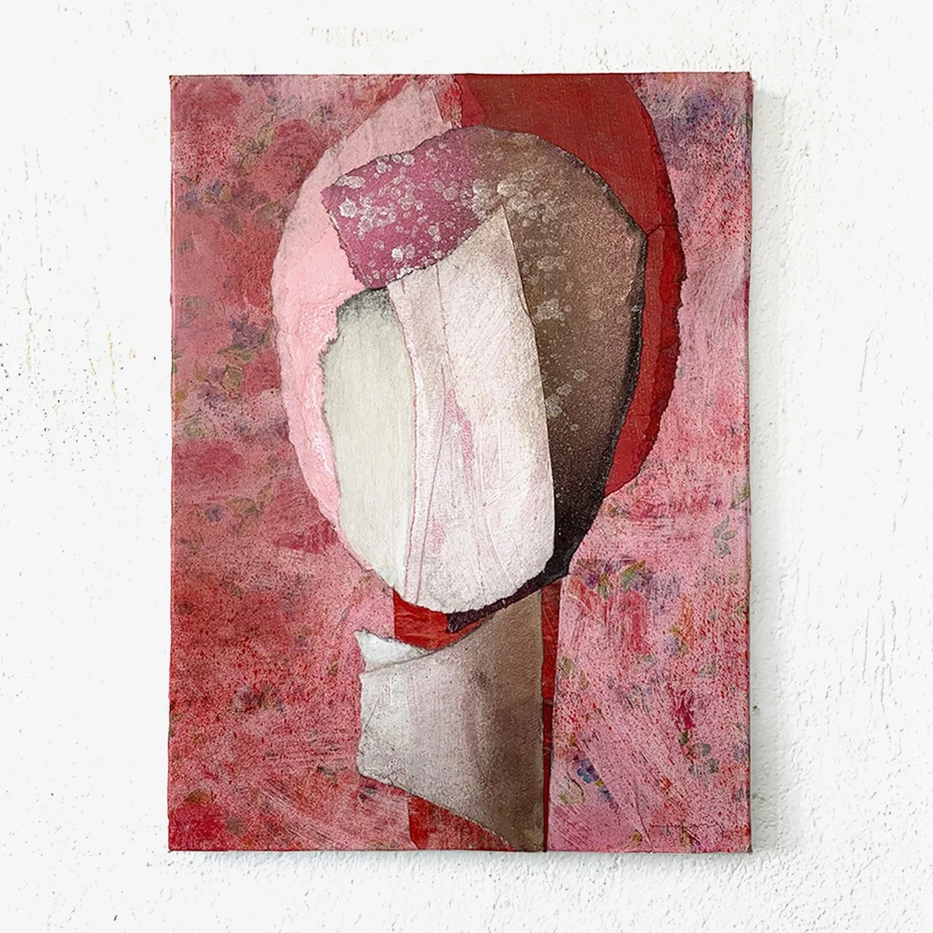 Abstract painting with flower shapes in pink, red, white, brown, and beige tones on a textured background.