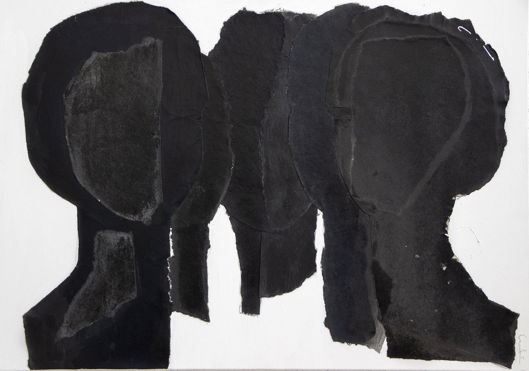Collage of black and dark gray pieces arranged to form the shape of an elephant.